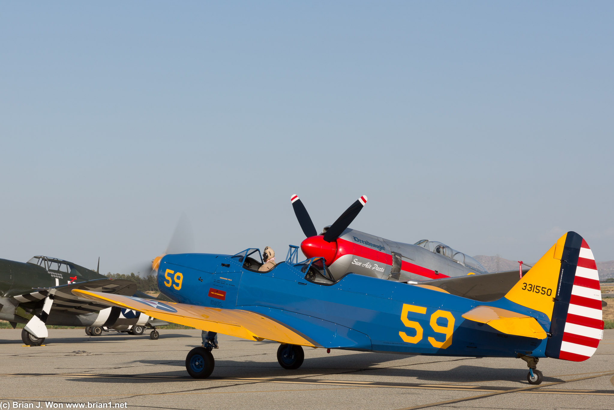 Fairchild PT-19 taxis as part of a massive 1930s-era formation.