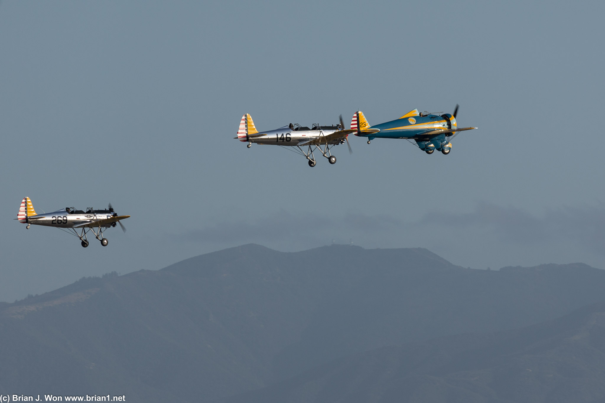 Boeing P-26 Peashooter (right) and two Ryan PT-22 Recruit.