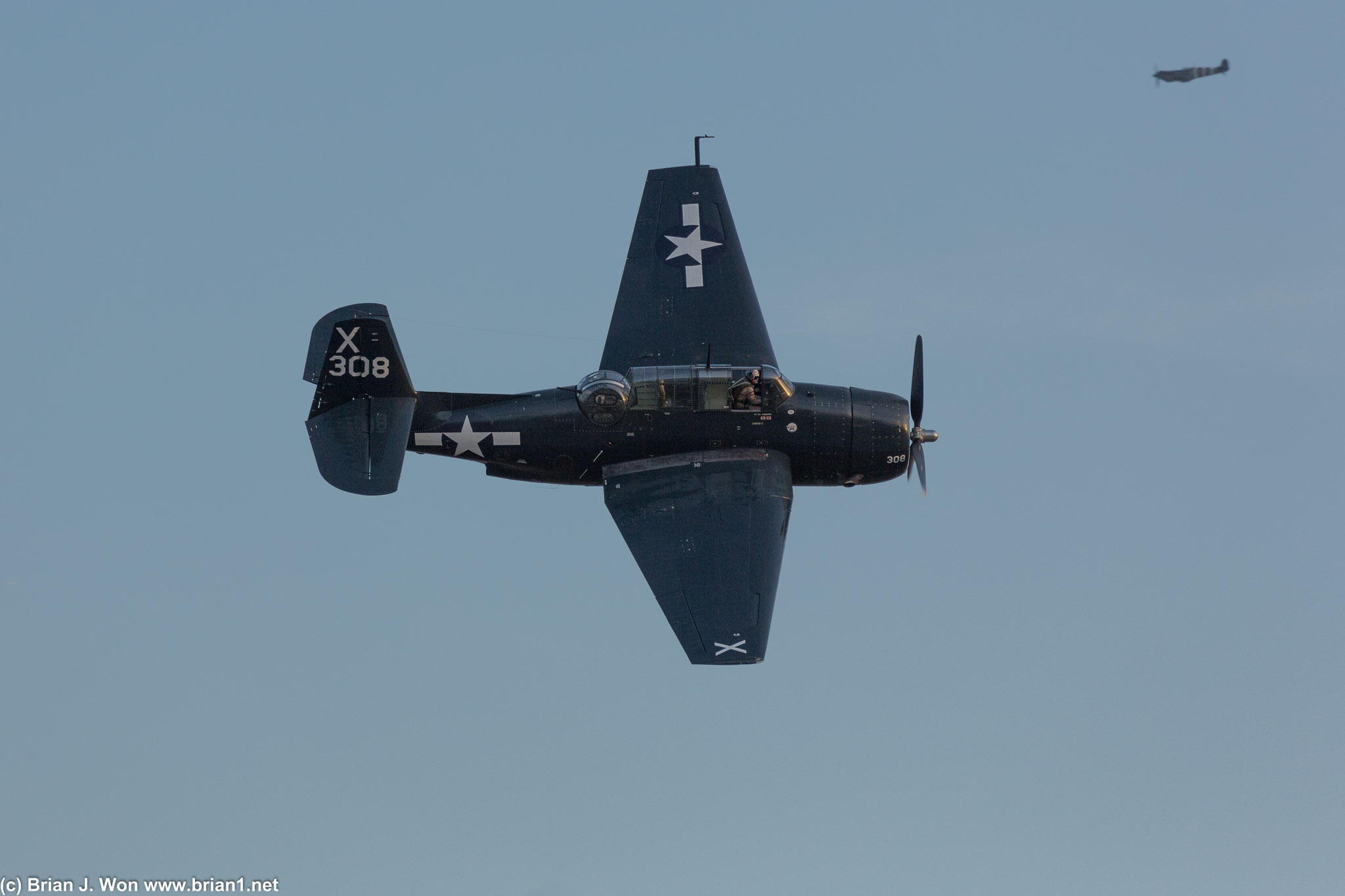 TBM-3E Avenger with Supermarine Spitfire in the background.