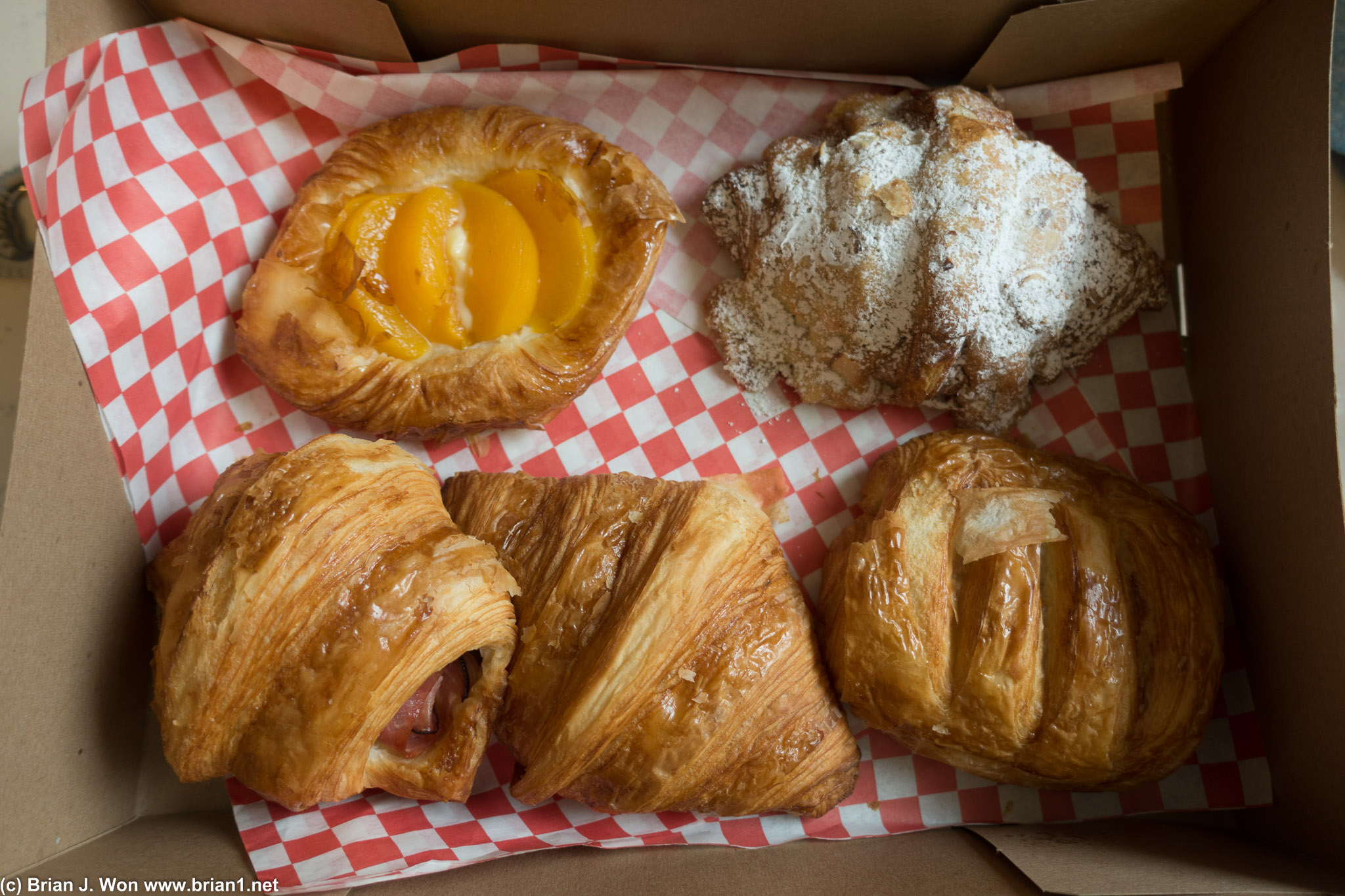 Clockwise from top left: apricot danish, almond, chocolate, plain, ham and cheese.