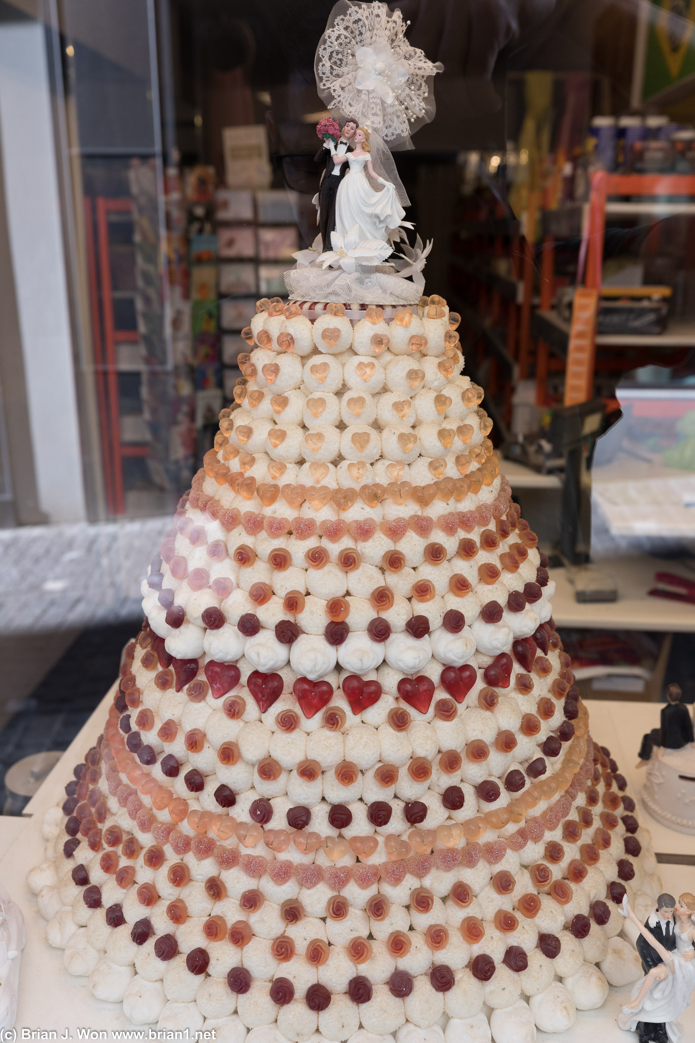Wedding cake "frosted" in marshmallows? Not sure if amazing or merely genius!