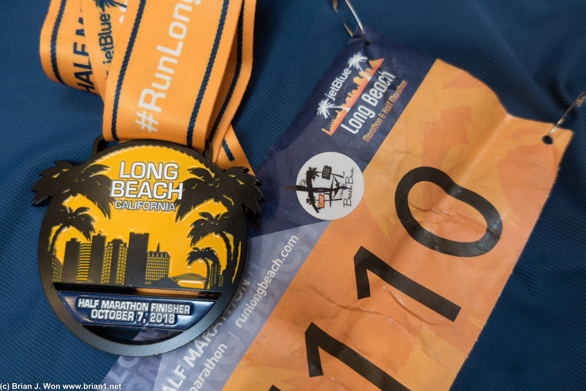 Long Beach Half Marathon bib and finisher's medal.