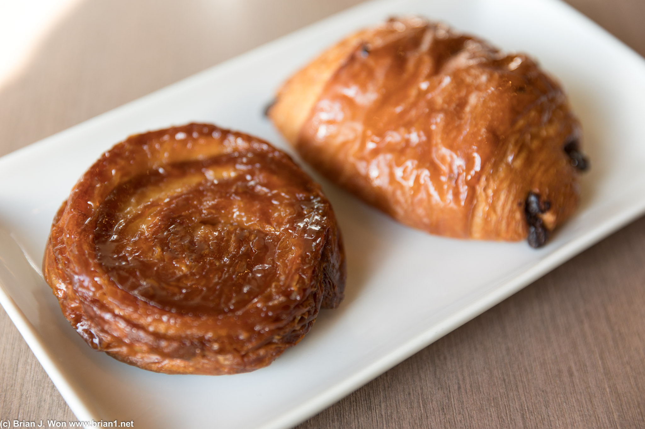 The weird, flat, hard, inedible thing on the left is allegedly a kouign-amann. o_0 Croissant on right was passable.