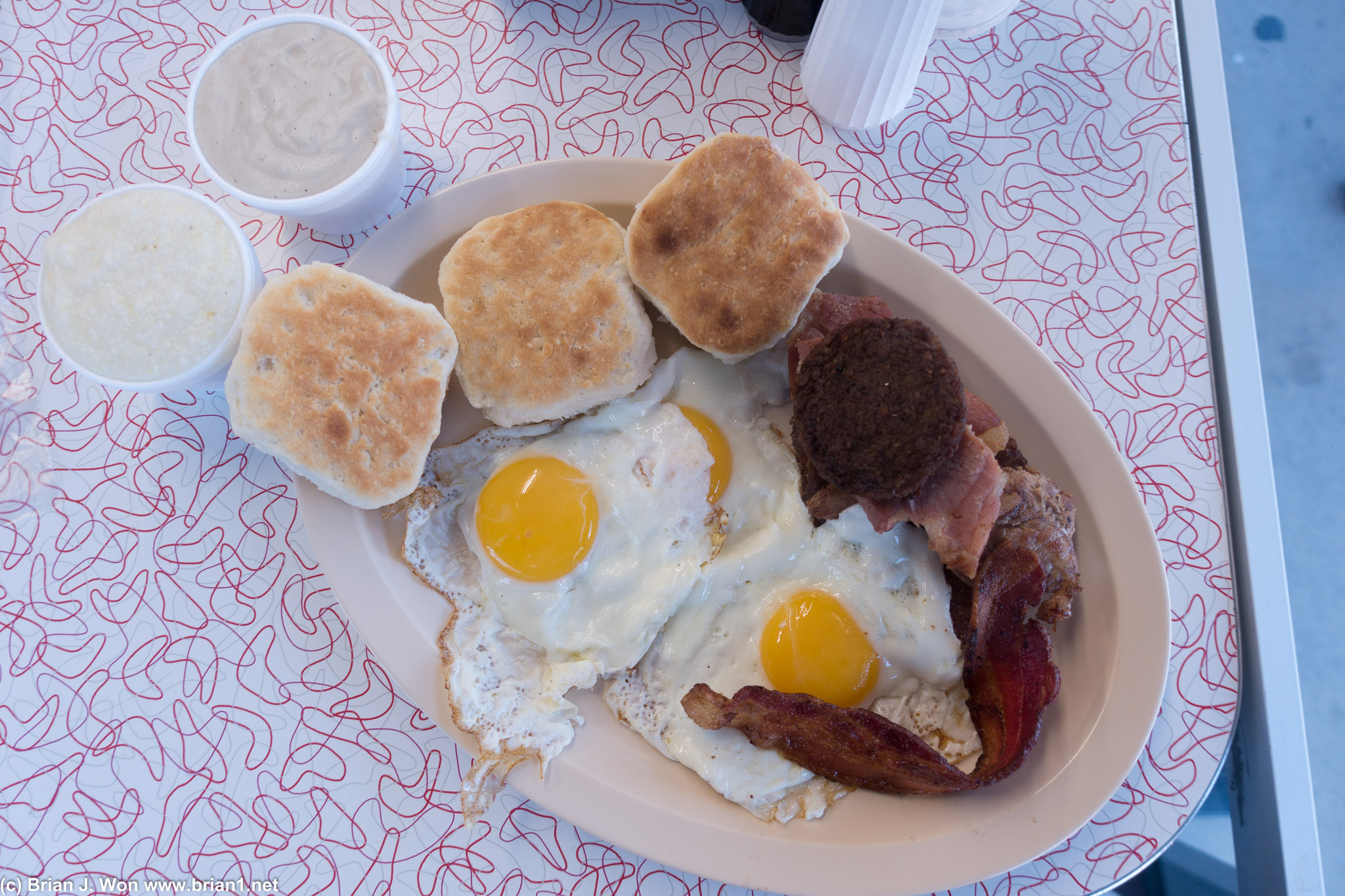 The sampler. Biscuits, three eggs, bacon, potato patty, country ham, bit of pork chop... no wonder Americans are fat.