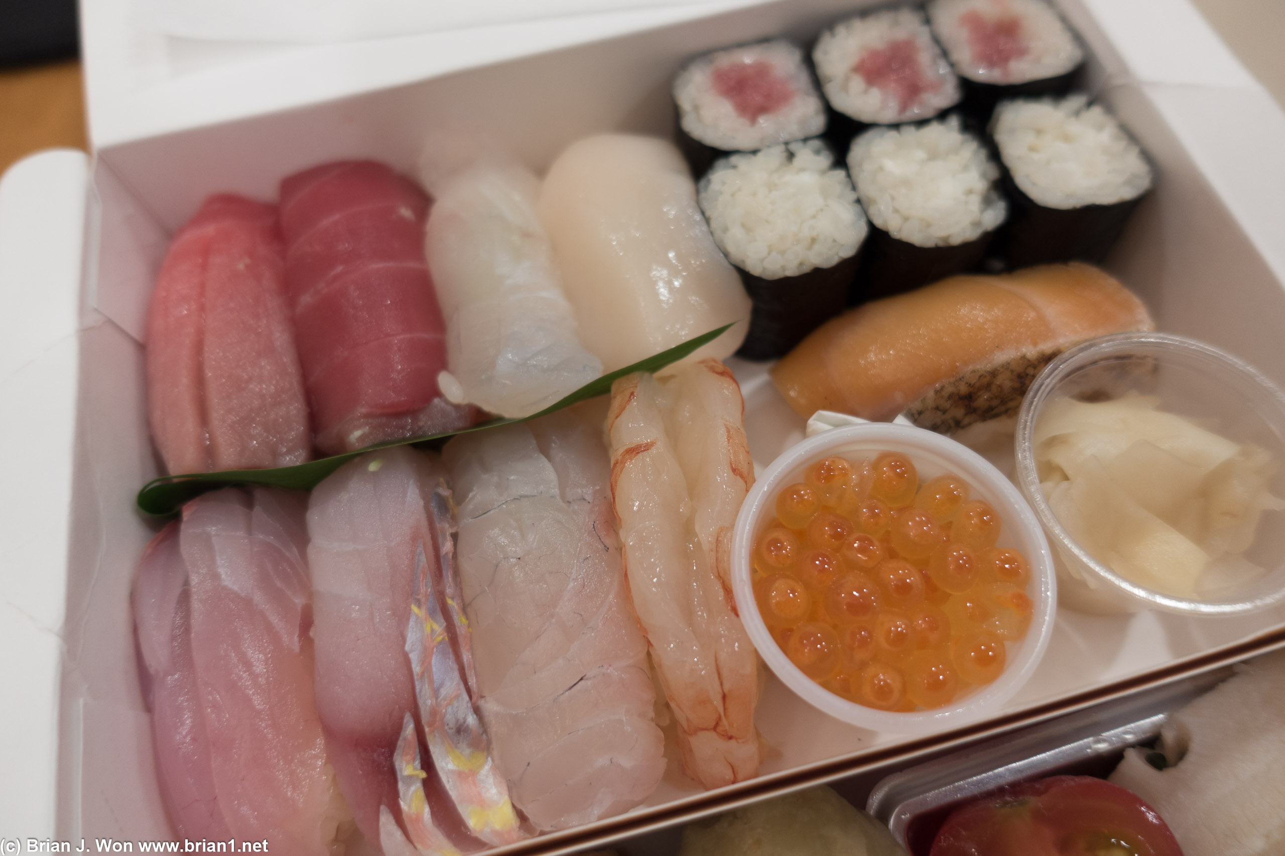 Clockwise from top left: chu toro, maguro, hirame (halibut), hotate (scallop), bluefin tuna roll, blue crab roll, salmon, ikura, ama ebi (sweet shrimp), kanpachi (amberjack),  itoyori dai (threadfin seabream), madai (red snapper).