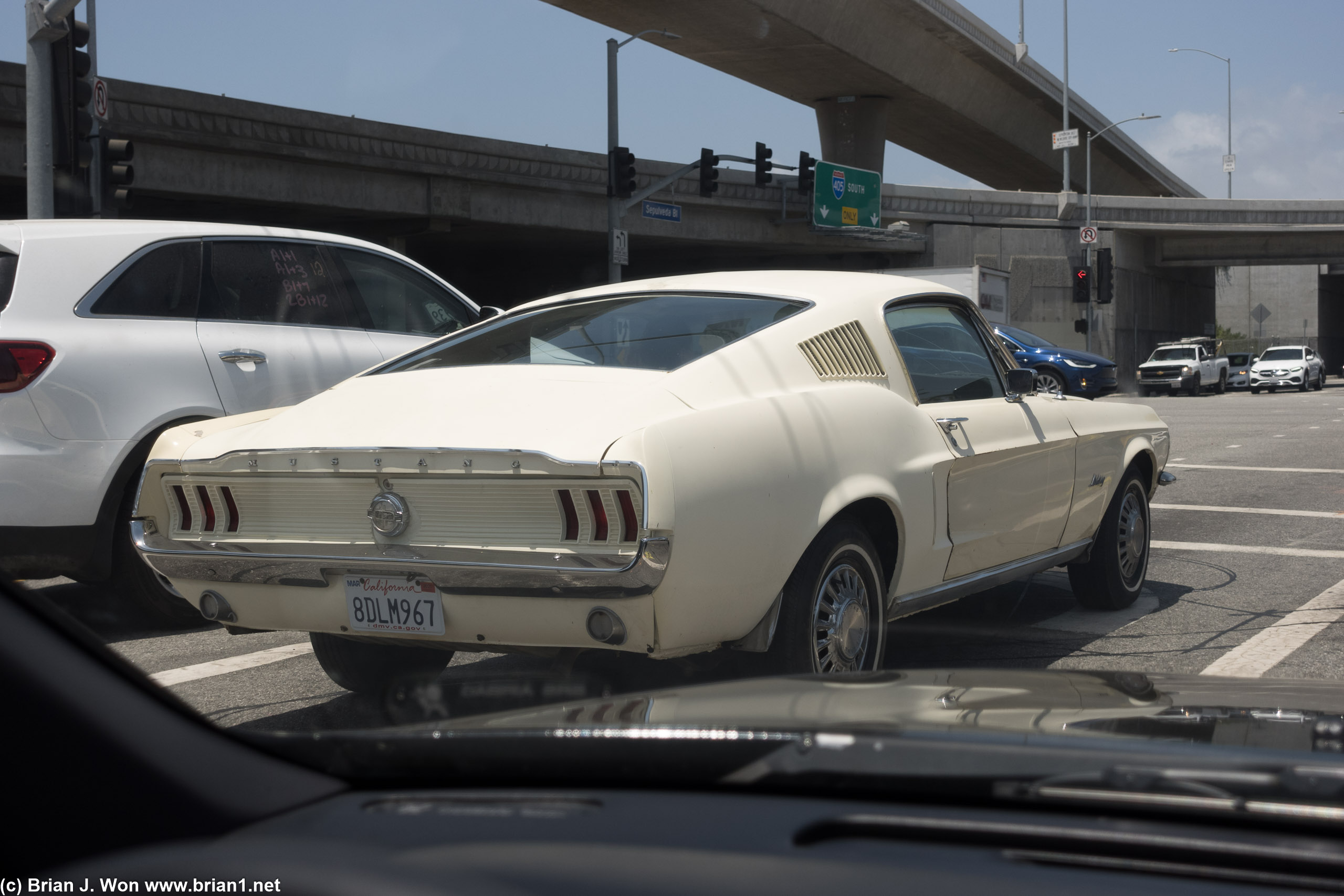 1968 Ford Mustang? (not sure on year) A bit rough but still a rare sight on the road even in a bit rough condition.