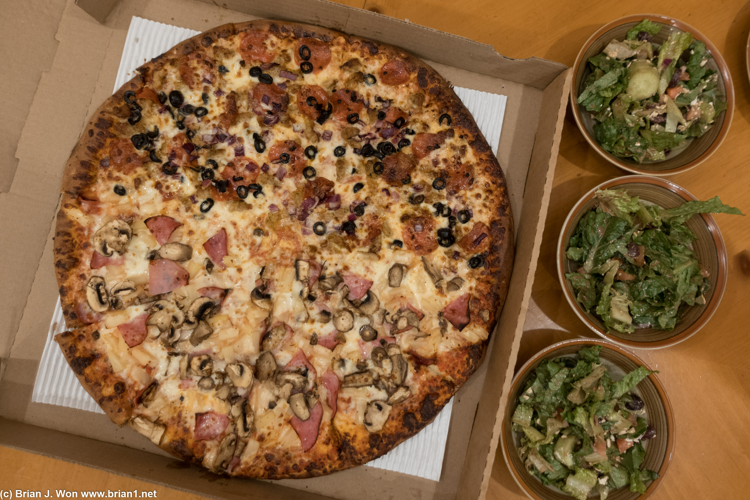 Lenzini's Pizza is okay. Utility. Greek salad was a good choice, needed veggies.