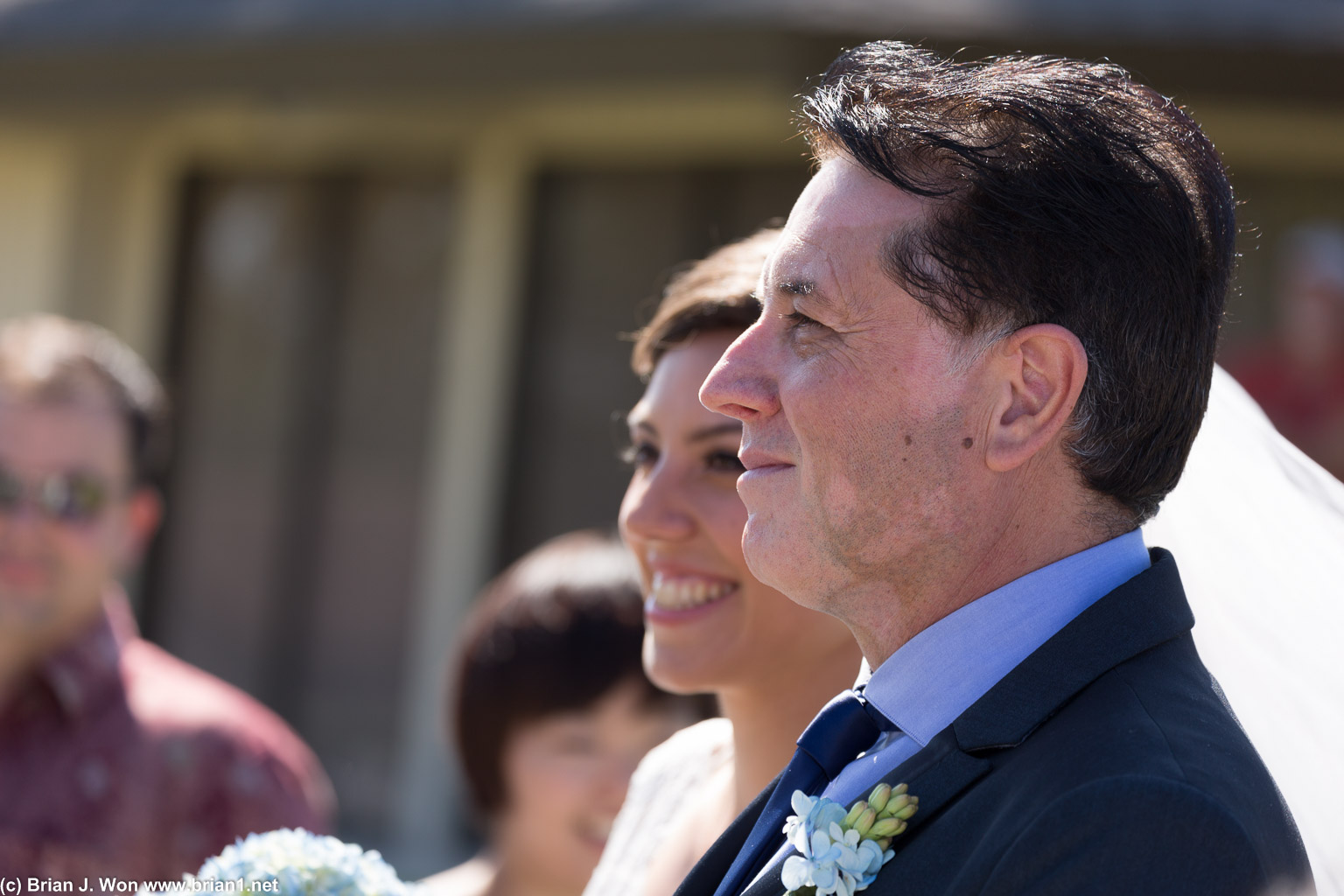 Father of the bride escorting the bride.