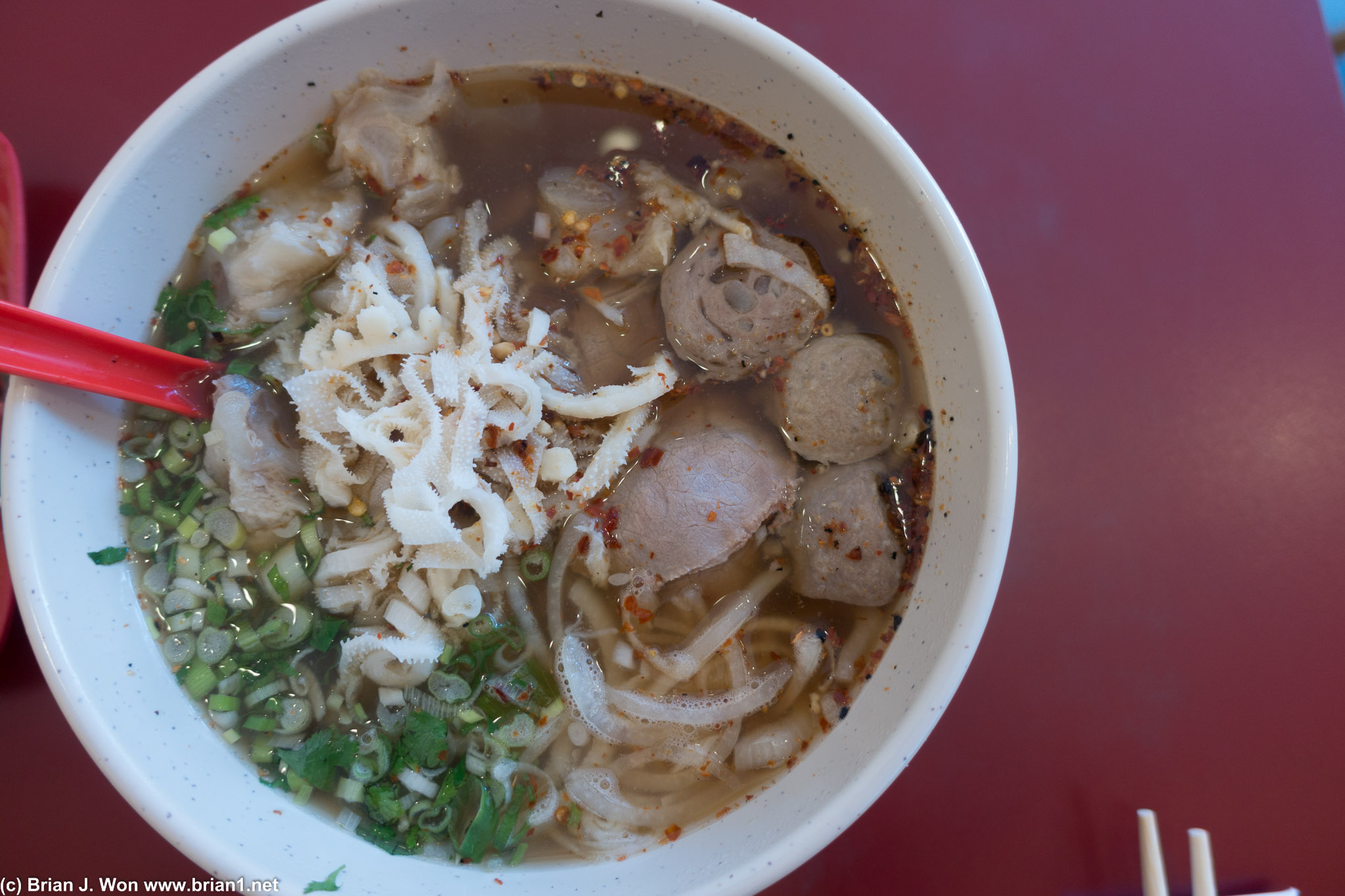 Noodle World "pho" is a bit weird. Chili flakes?