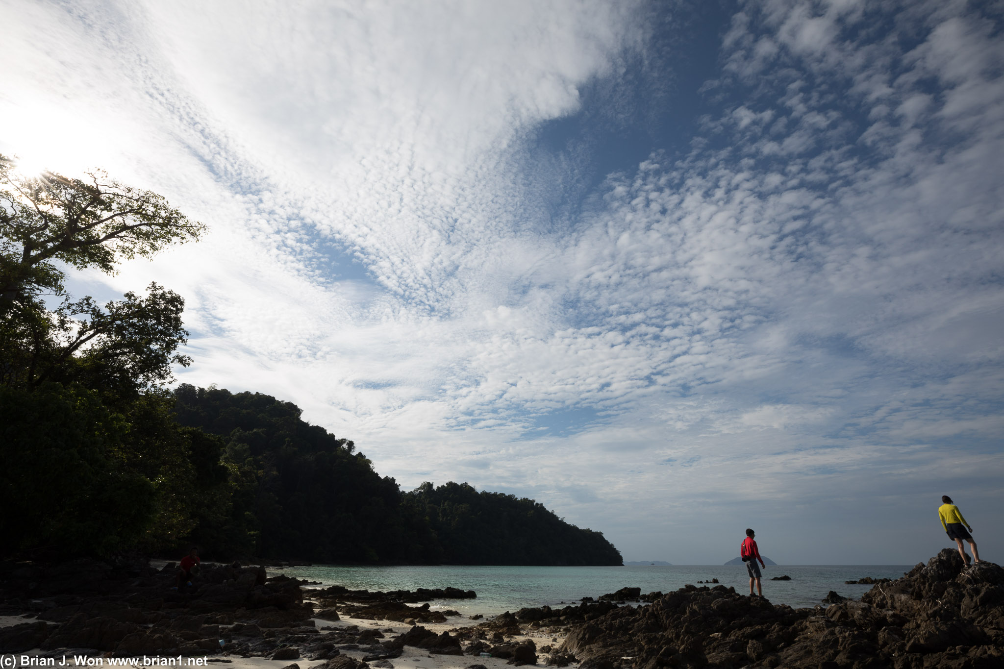 Clear turquoise waters and a beautiful sky full of clouds.