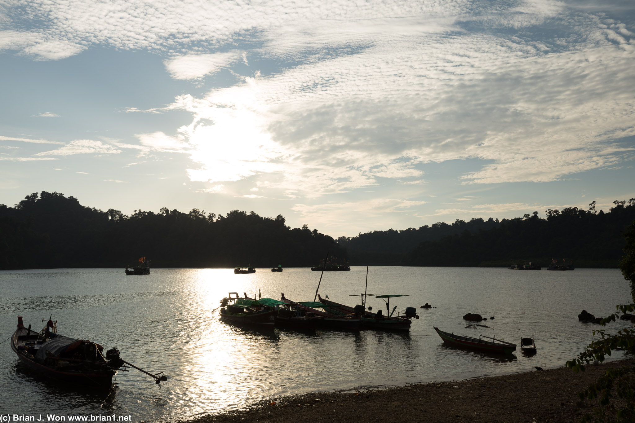 Tons of boats anchored near shore.