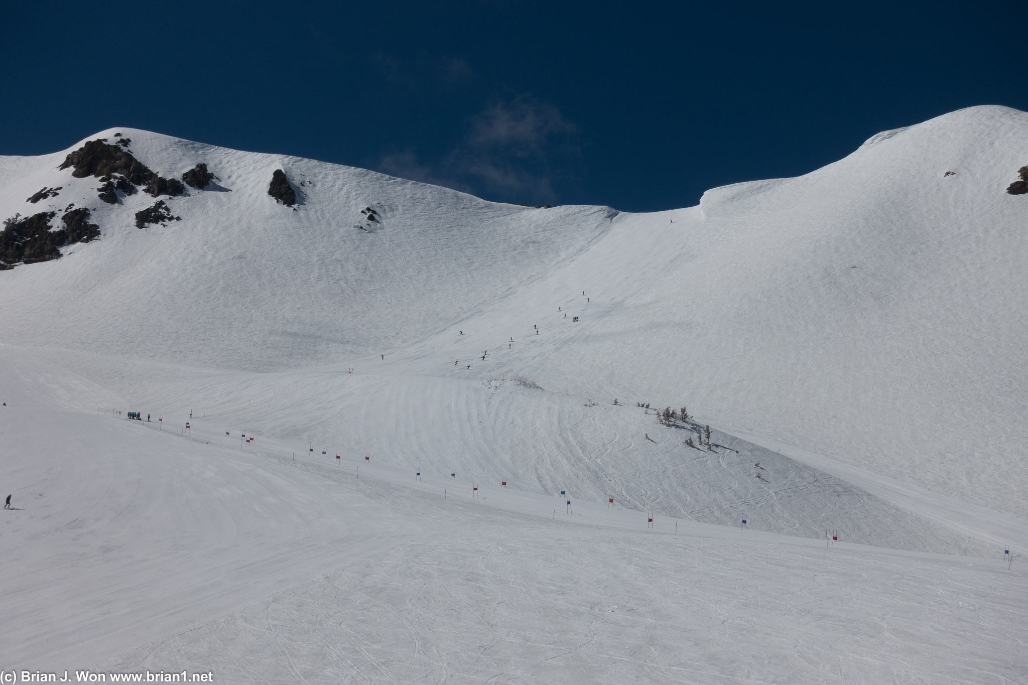 Ski team working down Cornice.