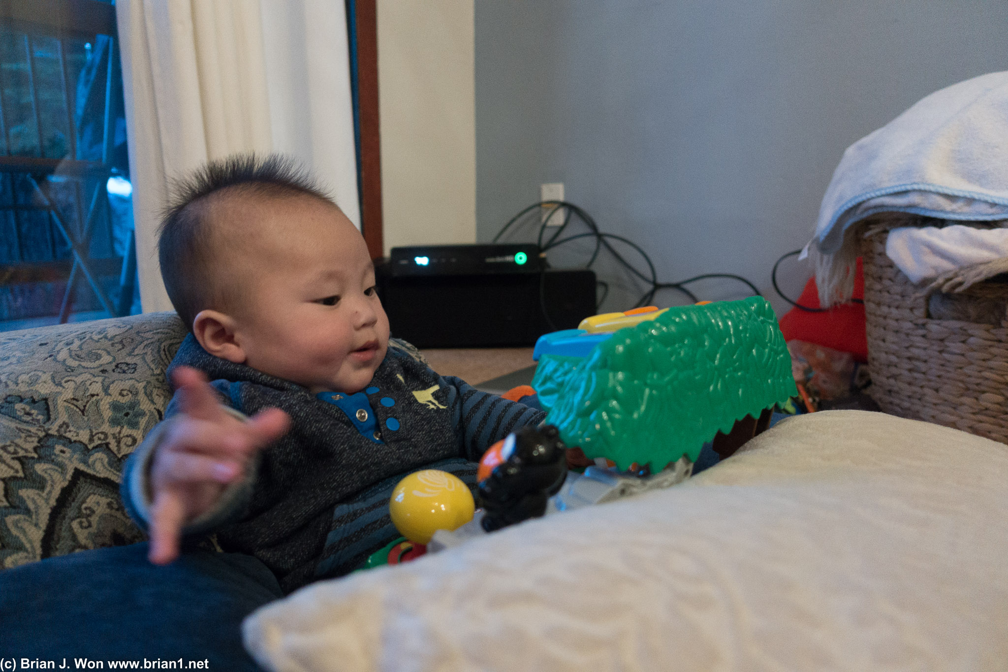 Playing with his toys.
