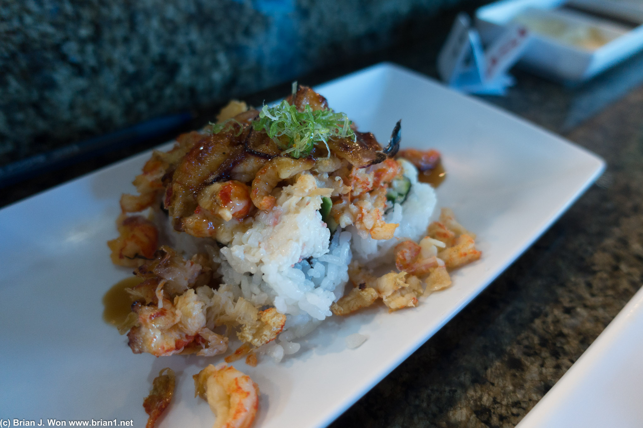 Baked crawfish atop California roll.  No flavor either.