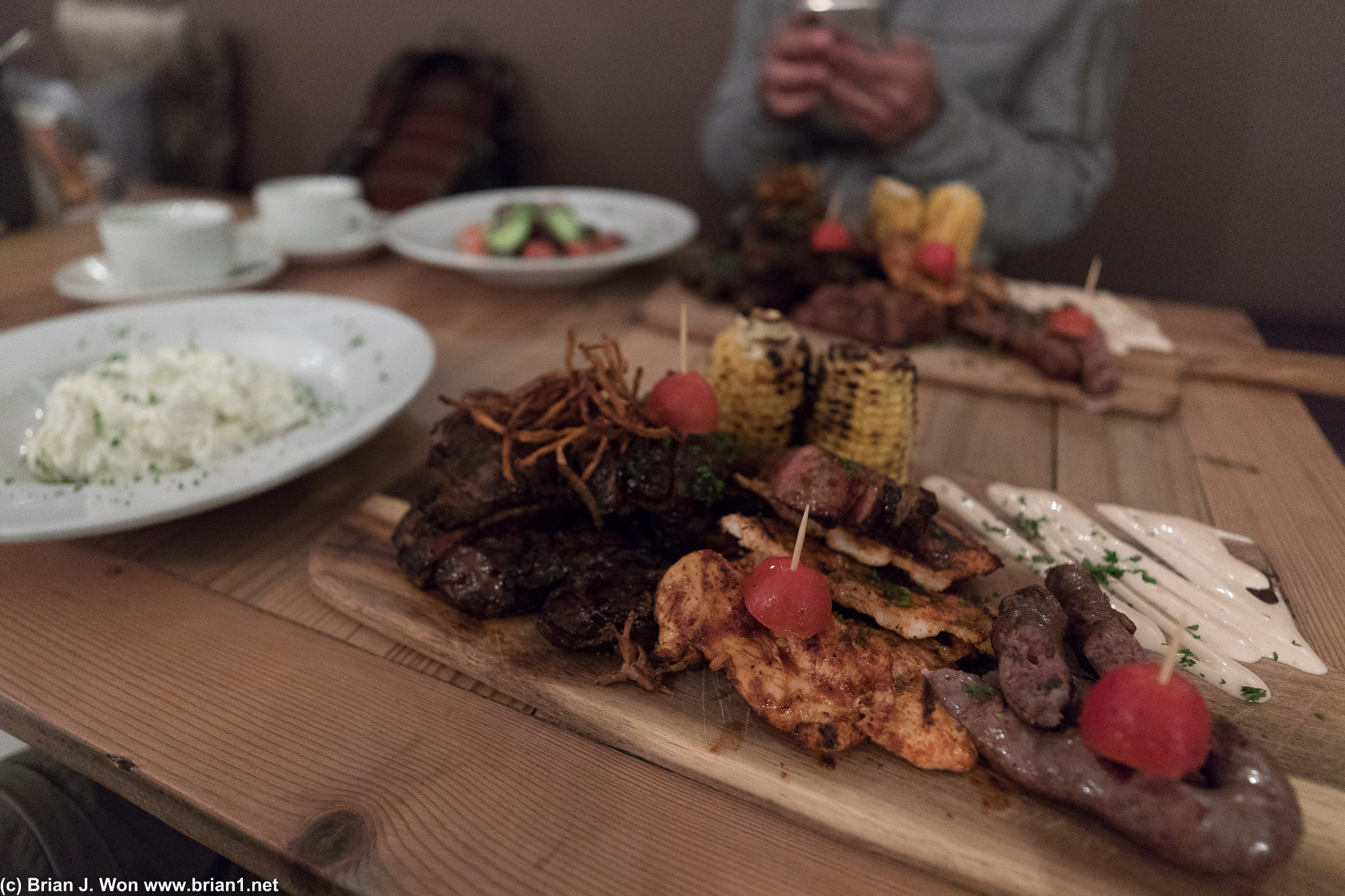 Pork, pork ribs, top sirloin, chicken, boerewors (sausage), and corn.