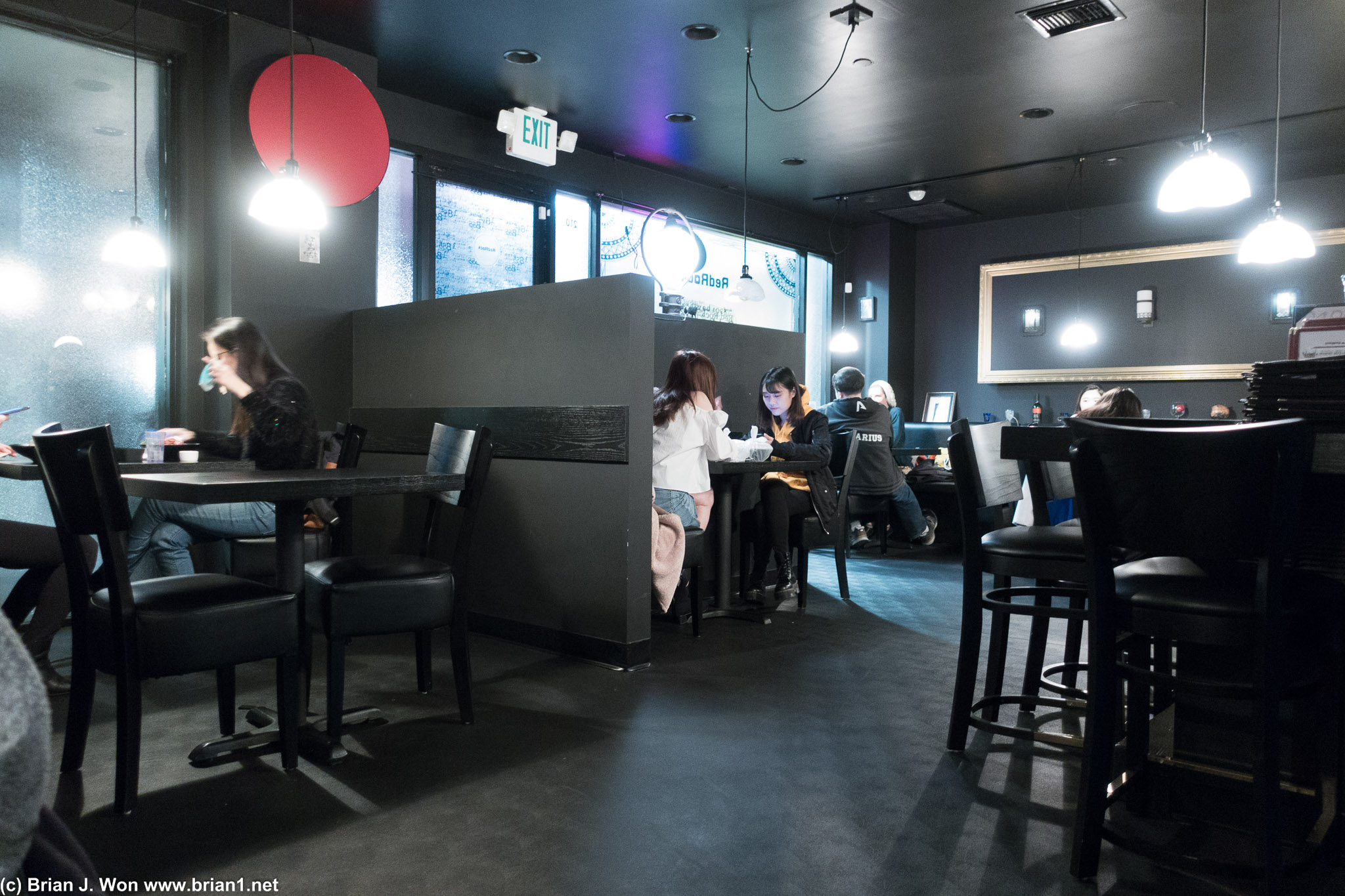 Restaurant layout is a bit strange. The entryway wall (middle) and the bar-like table (right) make for a strange flow.