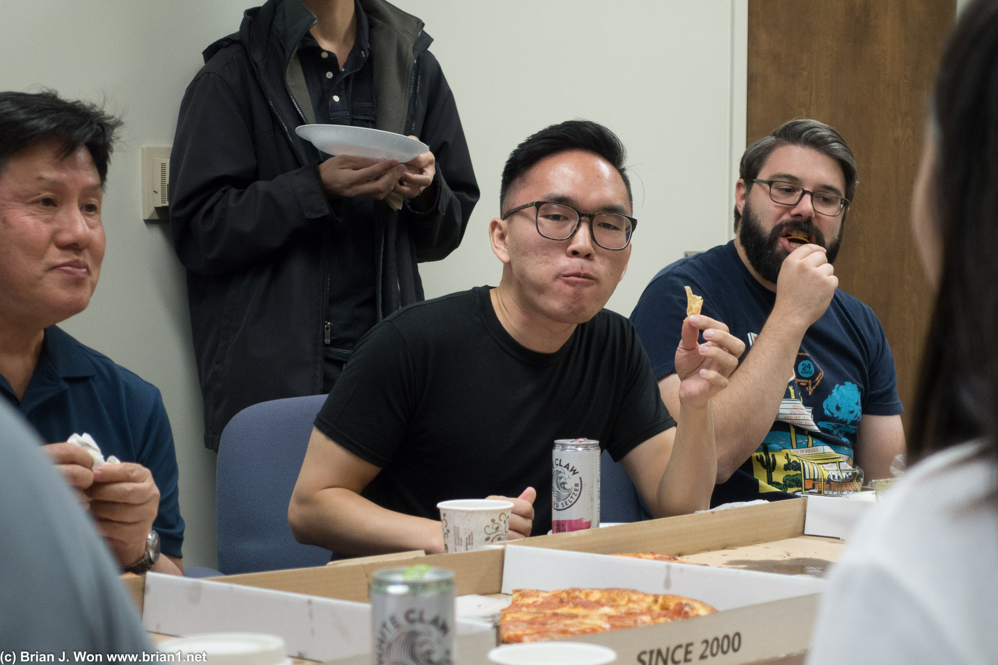Savoring his pizza.