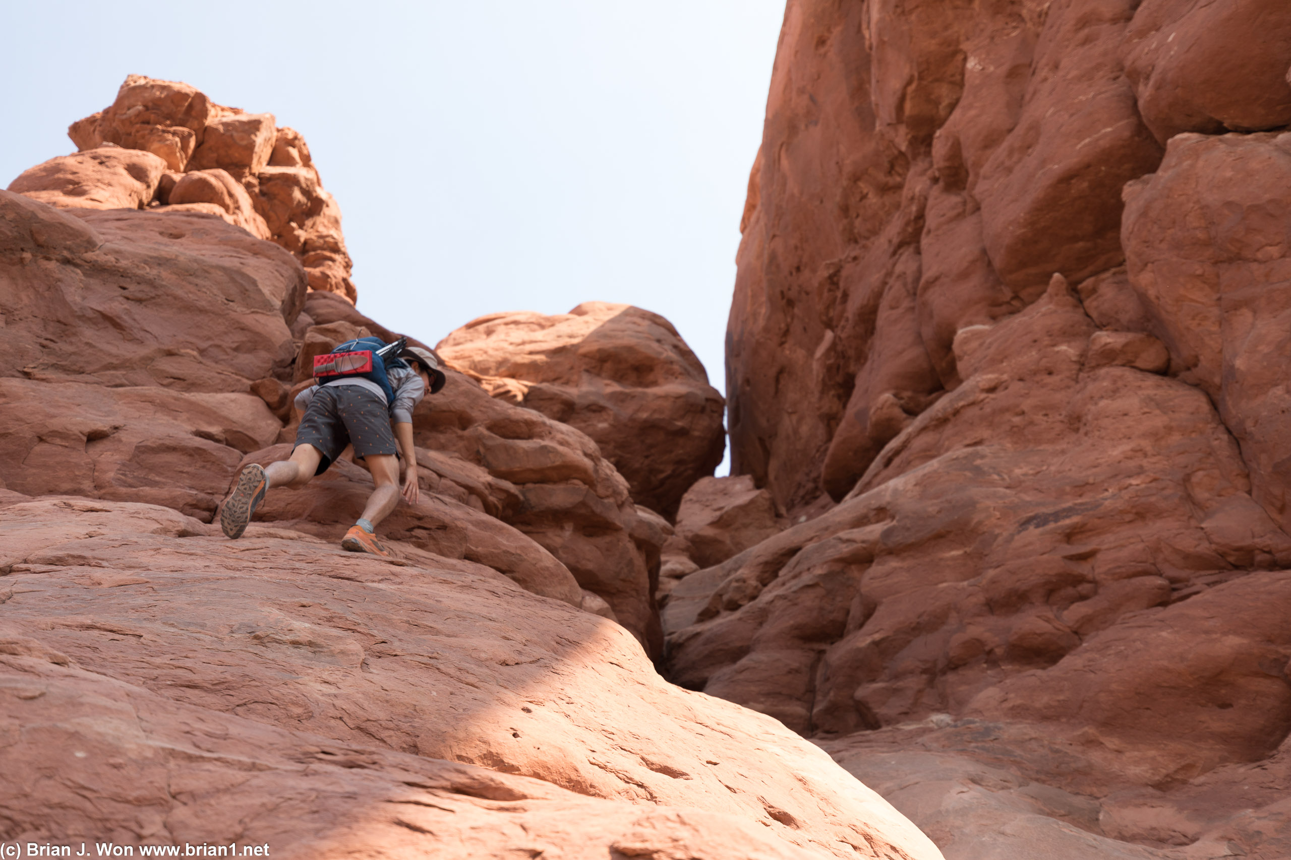 Scramblnig up the rocks.