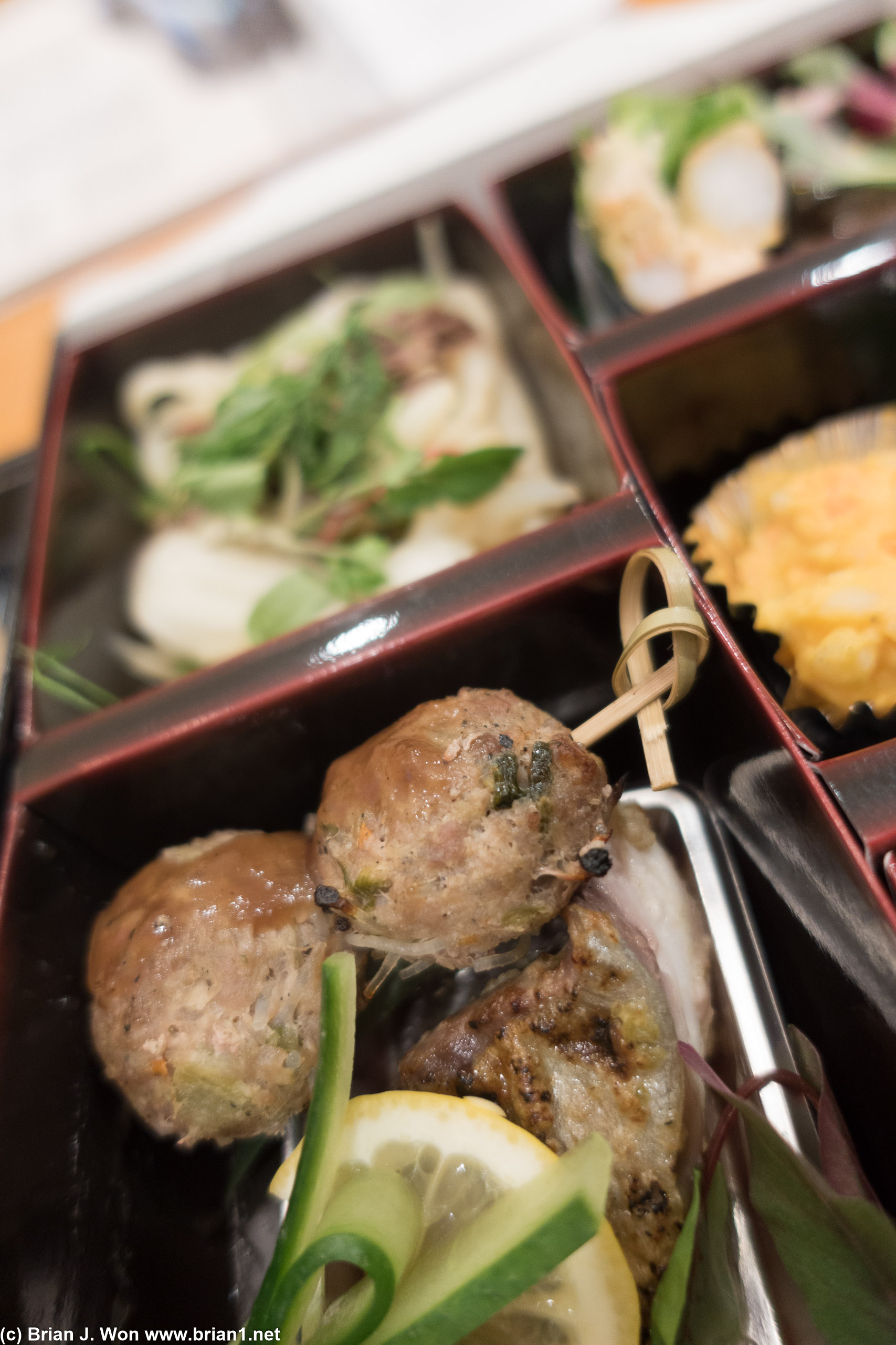Pork meatballs atop kanpachi.
