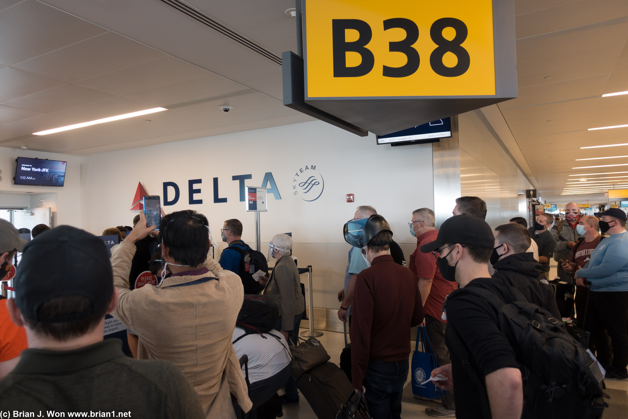 Woah, crazy face shield. Boarding area is chaos....