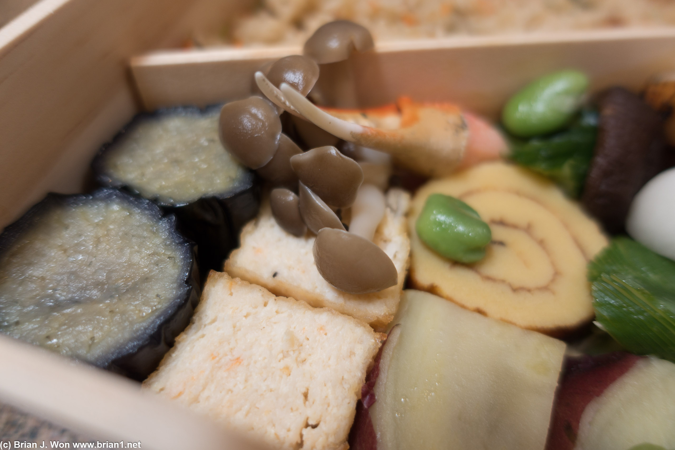 Honshimeji mushroom ohitashi showing off next to the snow crab claw and snow crab tofu.