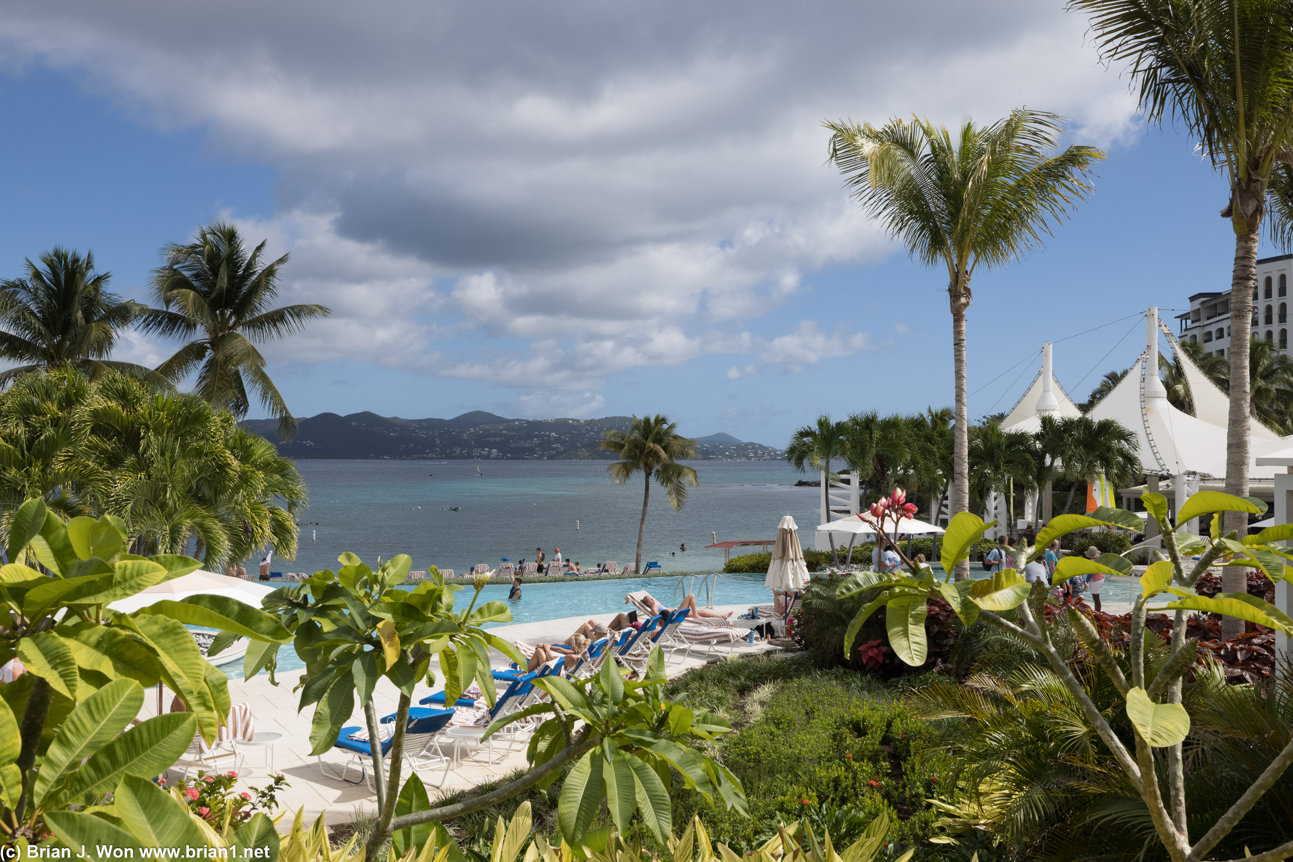 Noon and the pool loungers are busy.