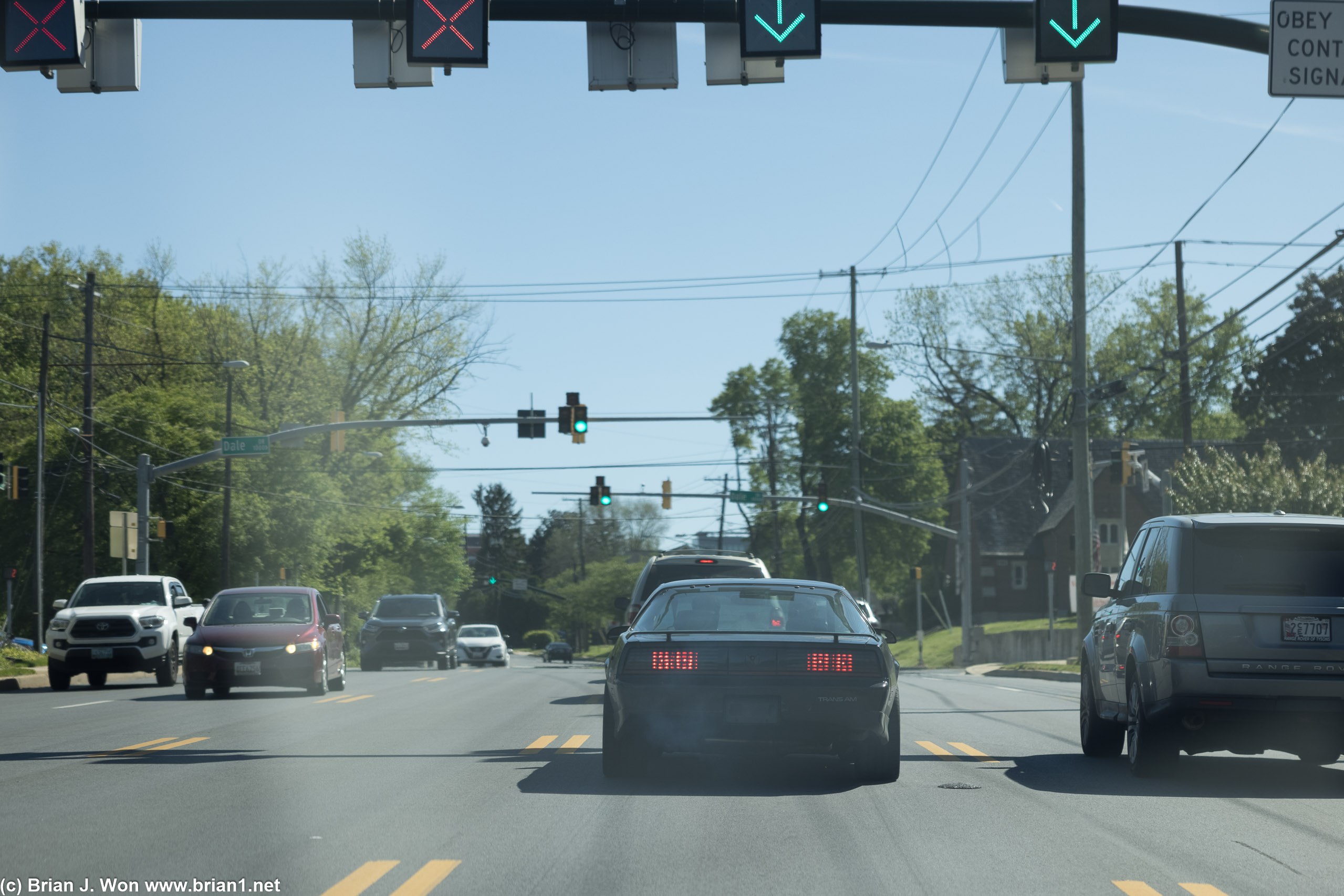Cruising very slowly down the road.