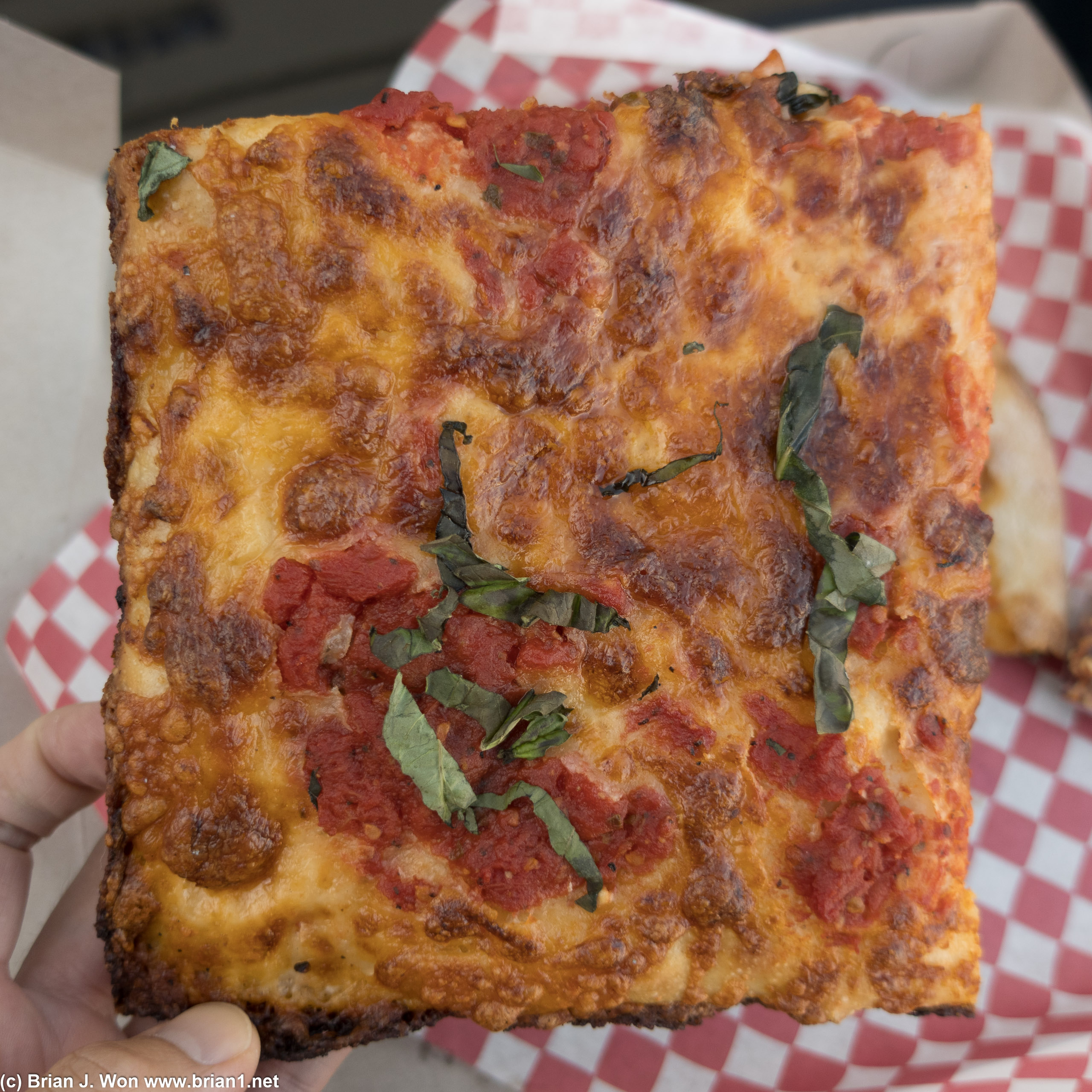 Also slim on toppings despite the generous size of the slice.