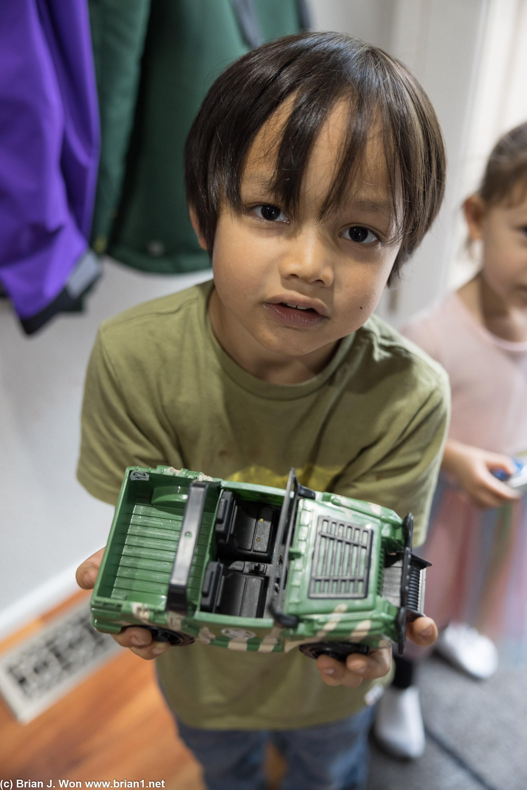 Showing off his trucks.