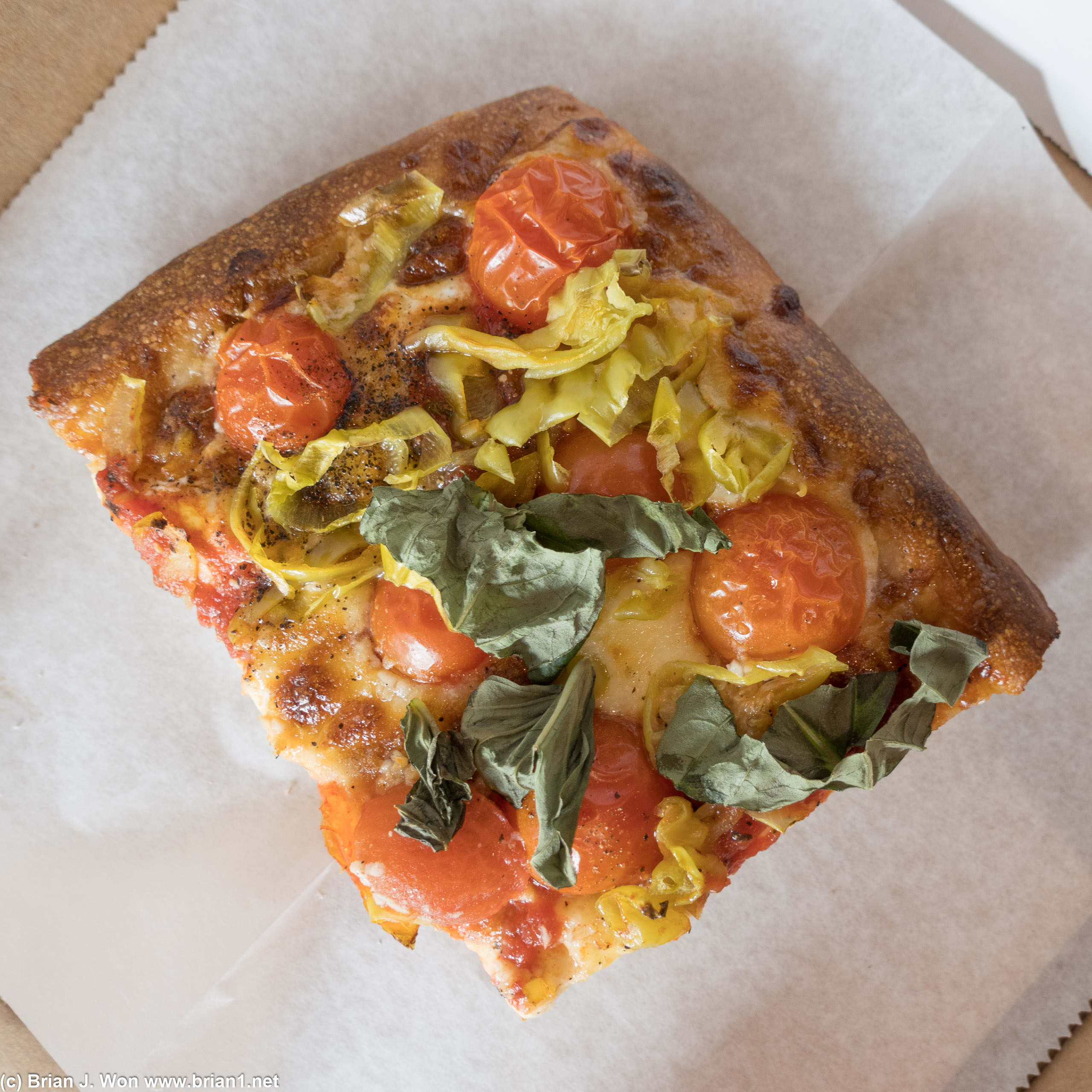 One of their newer pizzas. Cherry tomato, basil, pepperoncinis, garlic. Not bad but crust was a bit too thick.