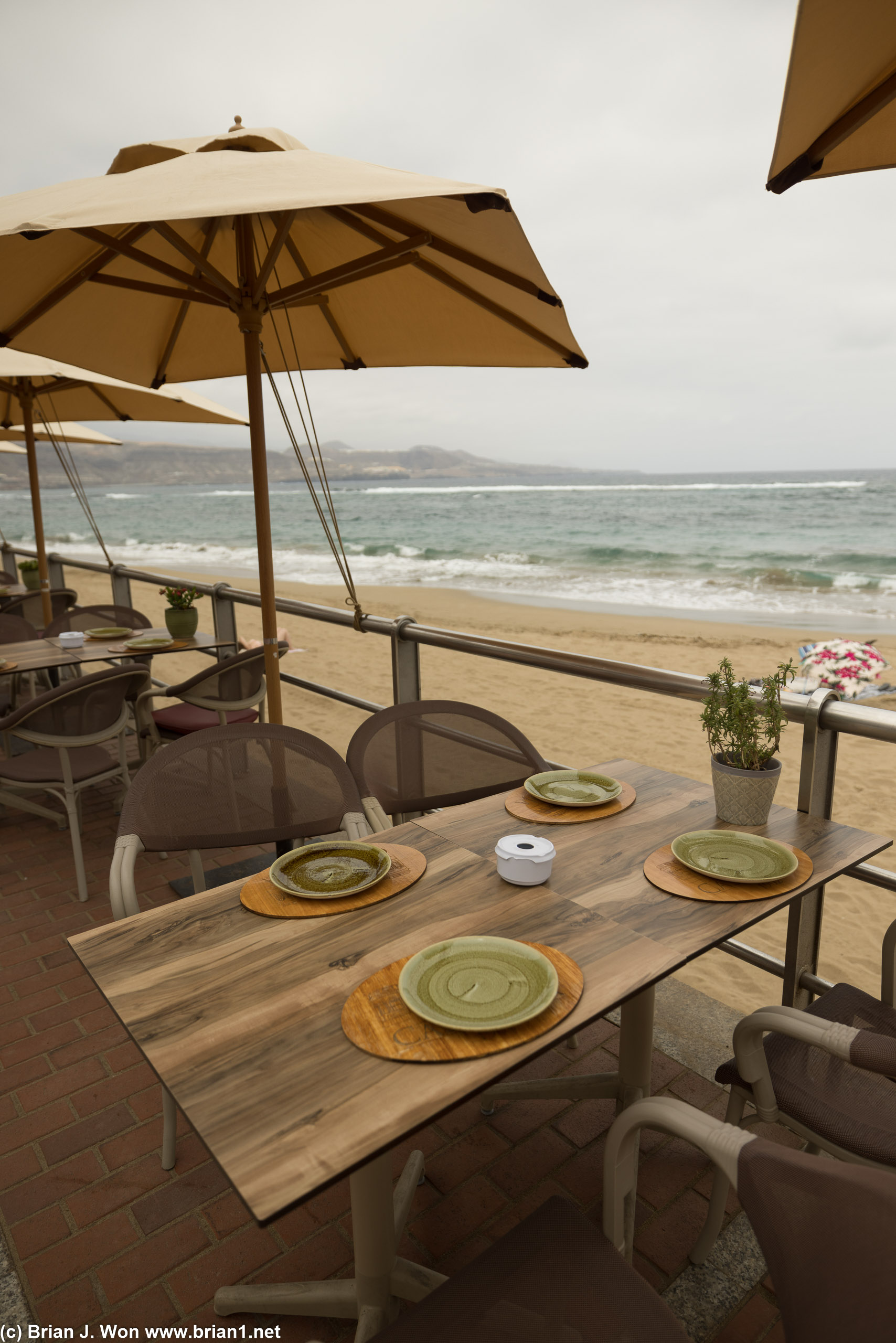 Seating at a different restaurant, further down the beach.