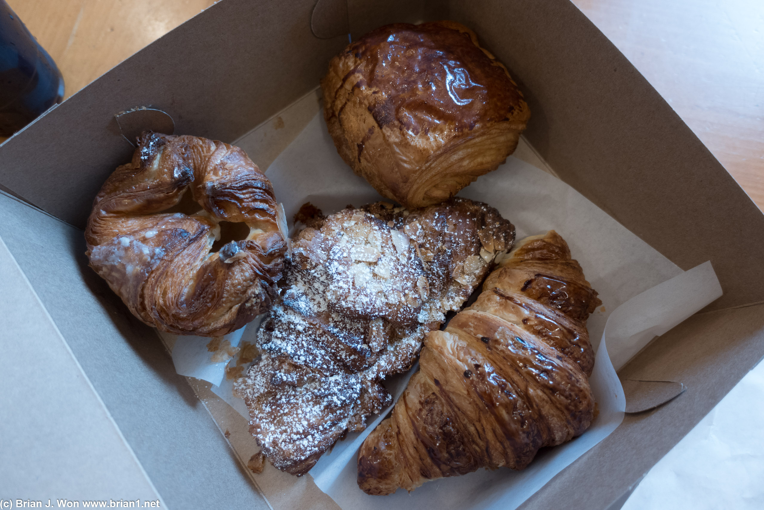 Clockwise from left: Kougin amann, pain au chocolate, croissant, almond-lemon croissant.