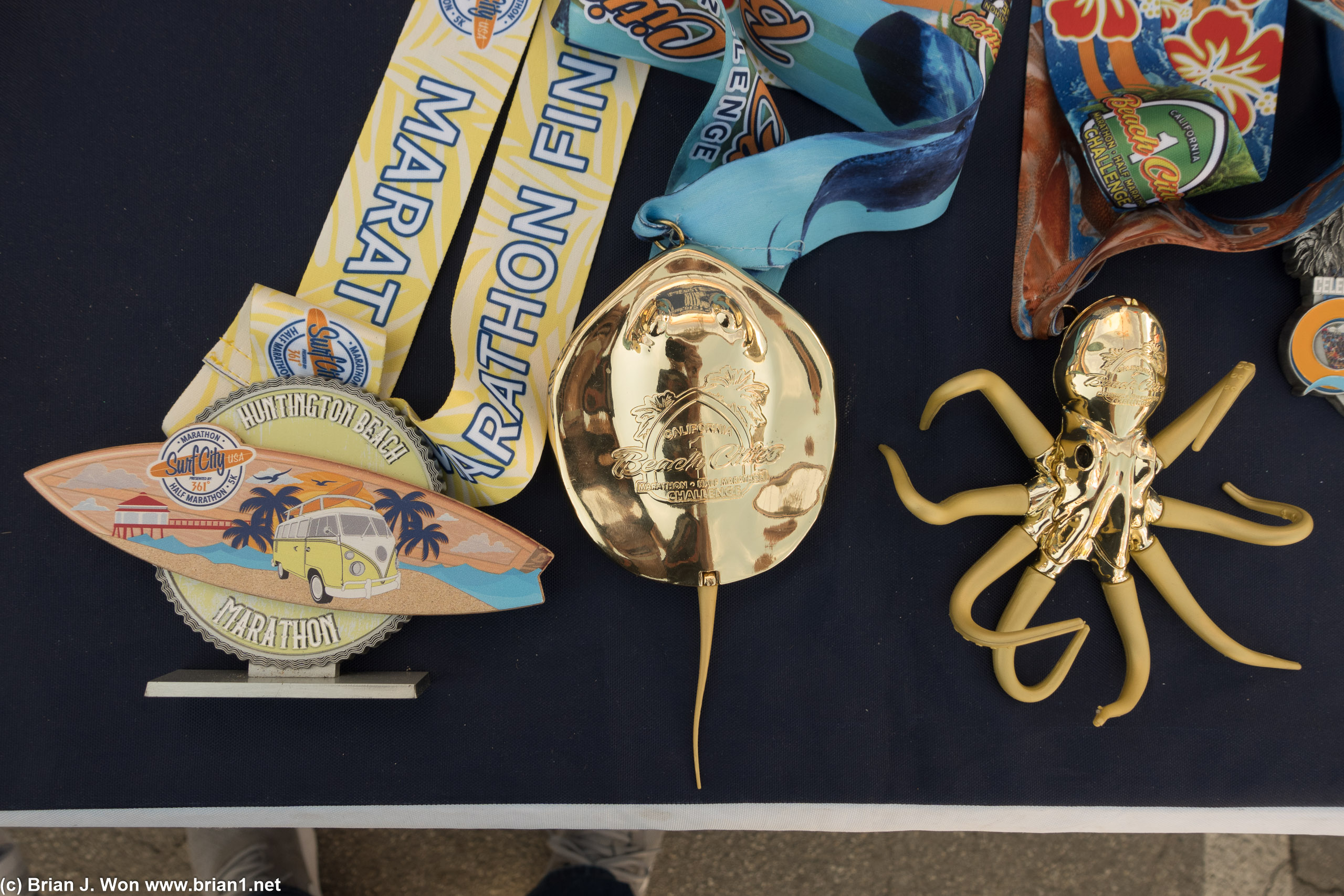 Don't have a Surf City Marathon medal, but I have the two Beach Cities Challenge ones.