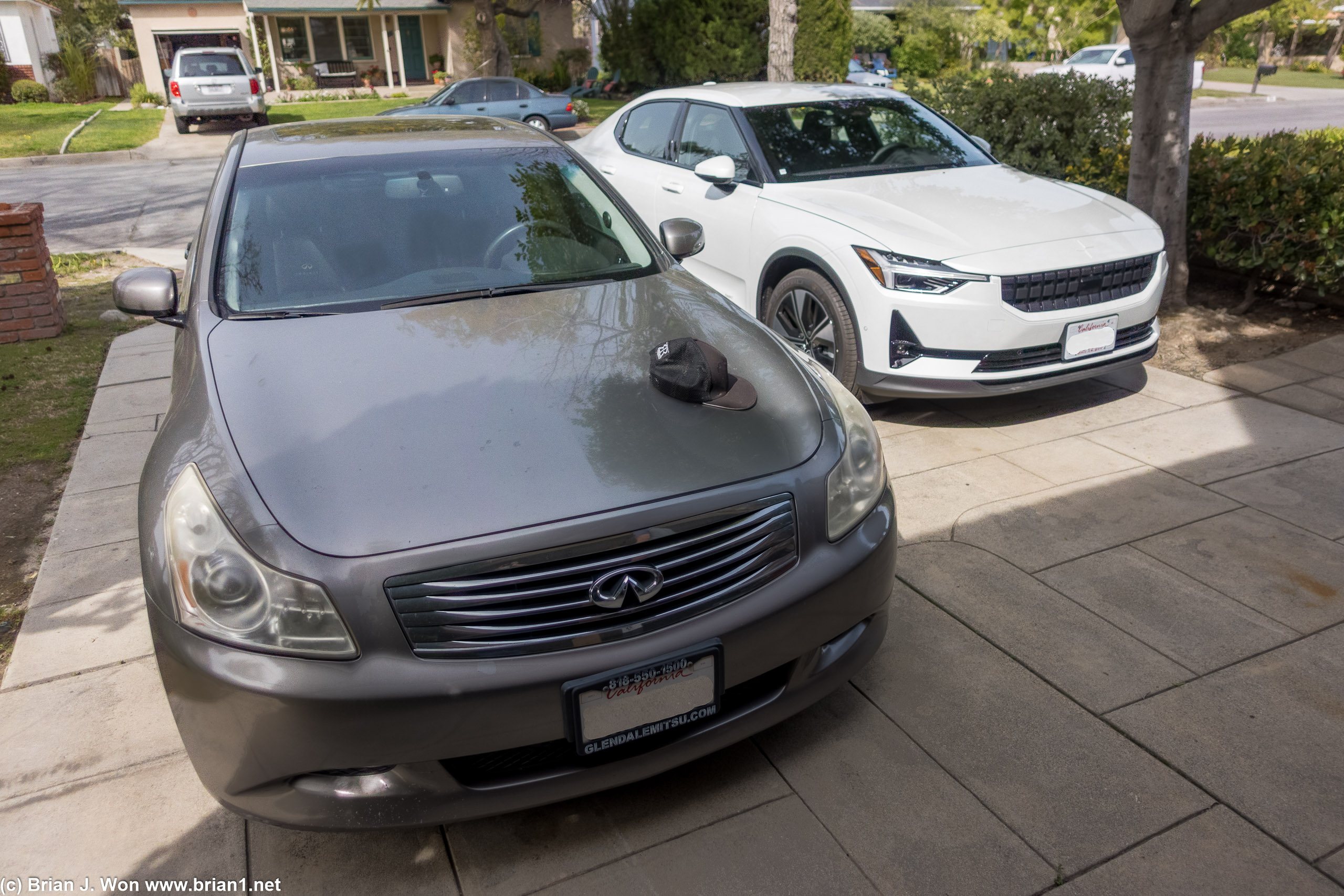 Keezer's G37S sedan 6MT next to a Polestar 2 Dual Motor LR.