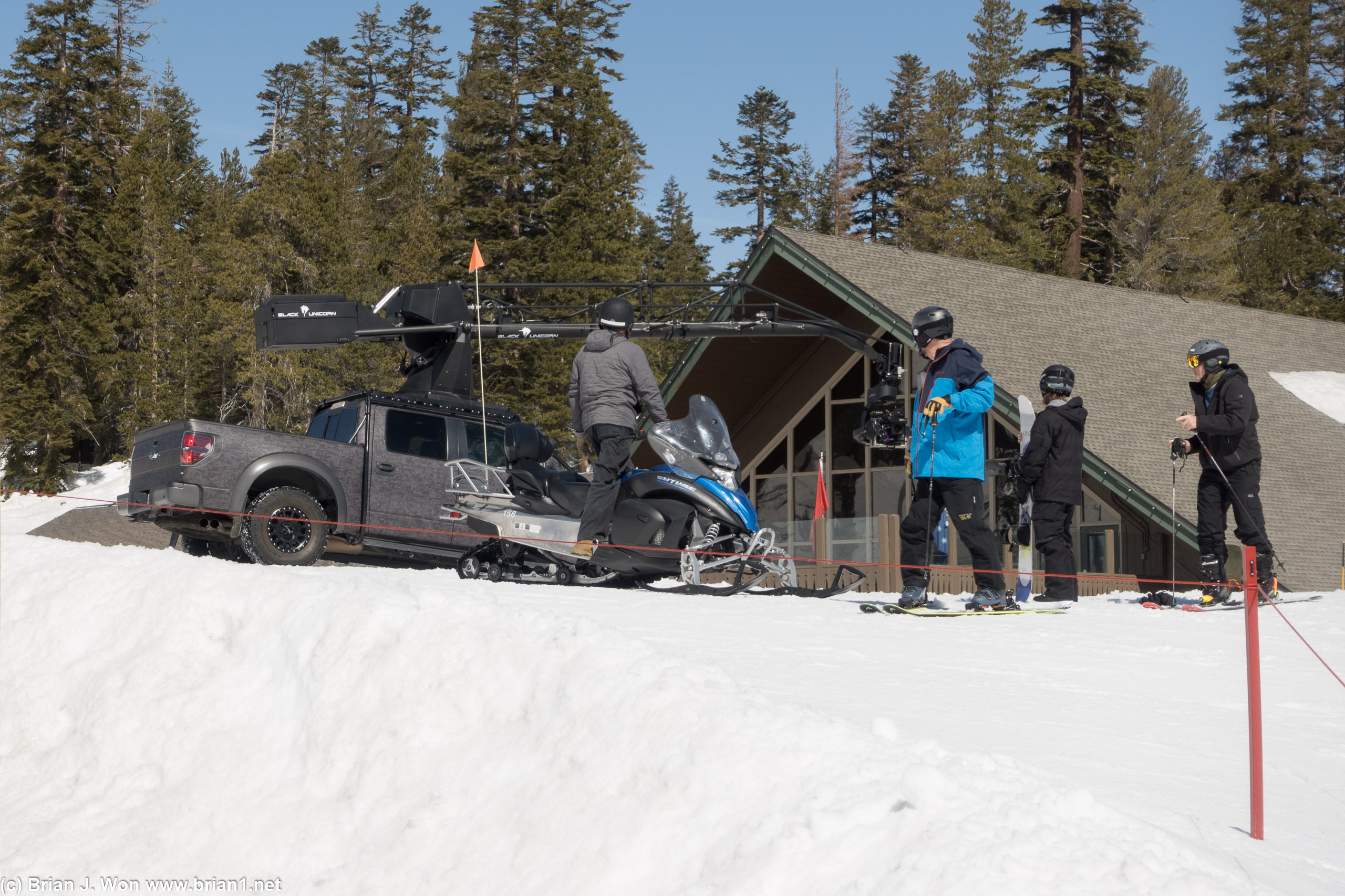 Film crew with fancy truck.