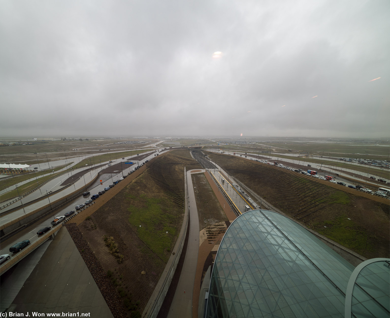 Lots of traffic coming in and lots waiting for passengers on the shoulder.