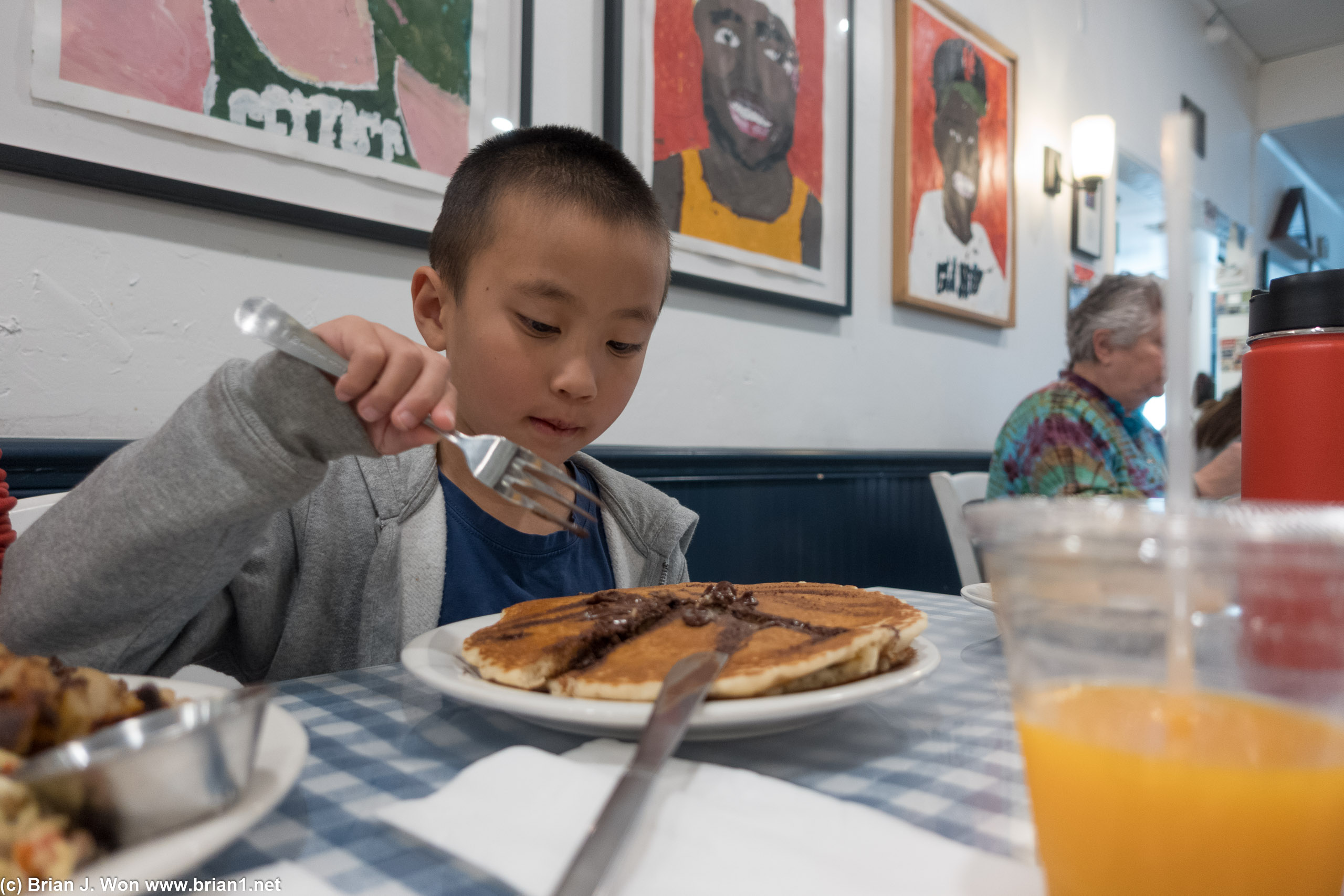 He loves his chocolate chip pancakes.