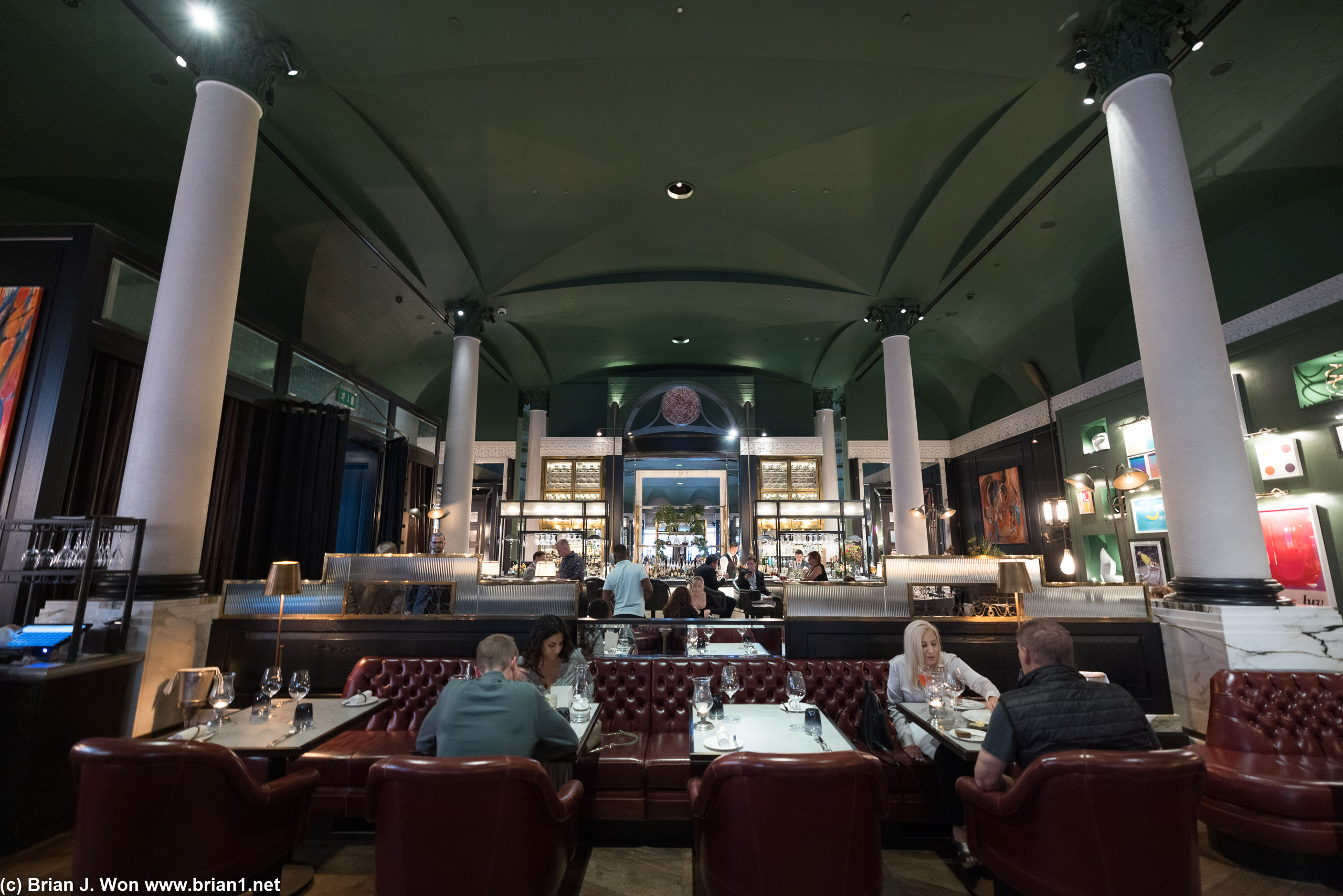 Inside, towards the bar.