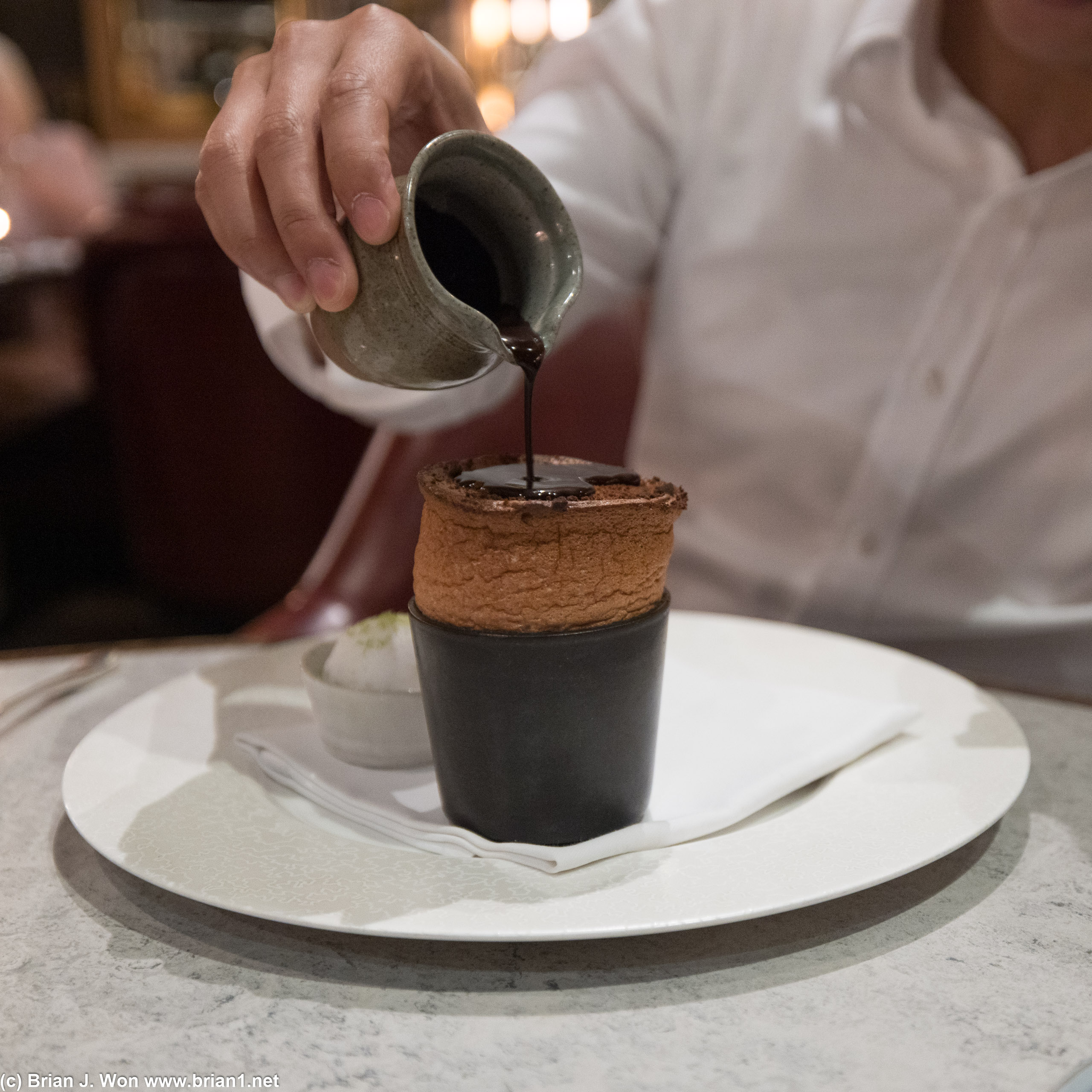 Banana souffle with coconut sorbet and chocolate sauce.