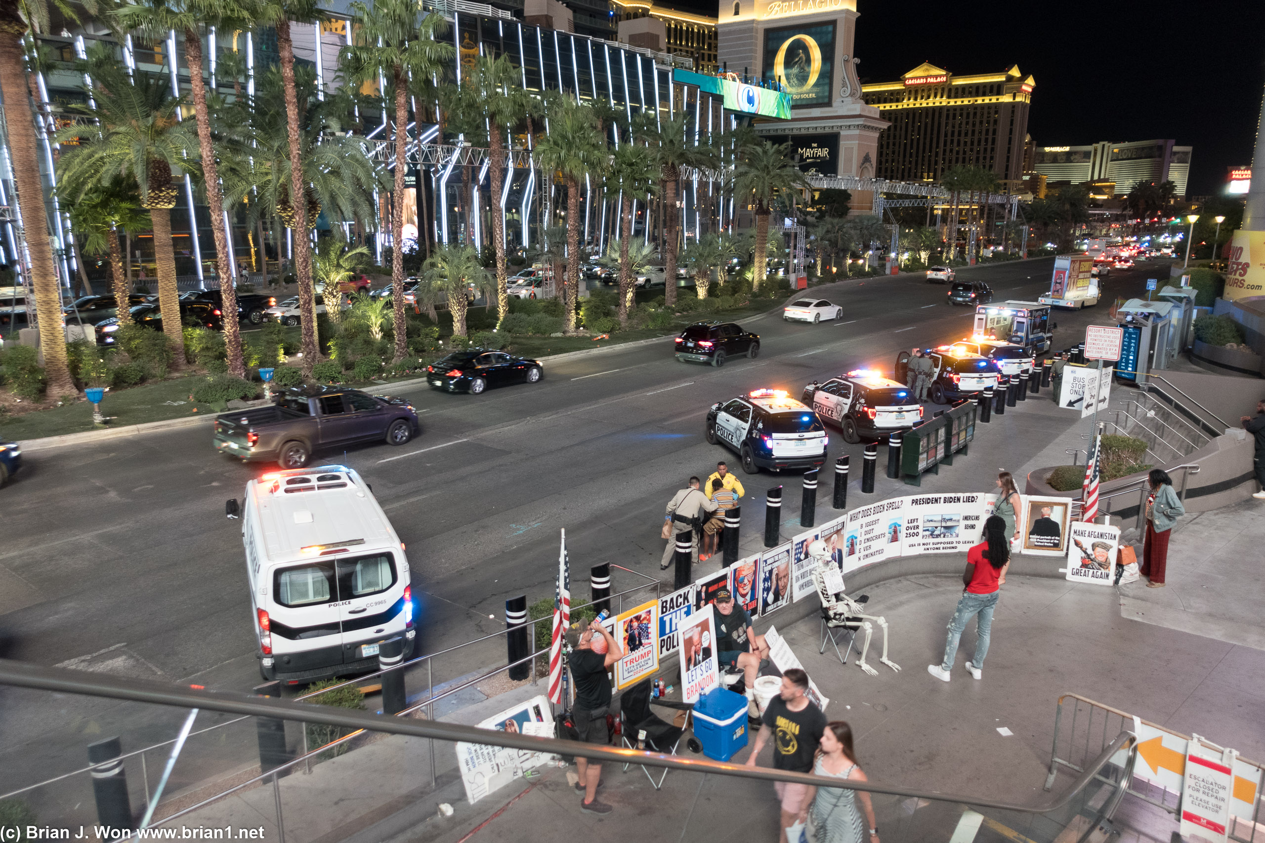 So many police cars next to a bunch of assholes who hate democracy.