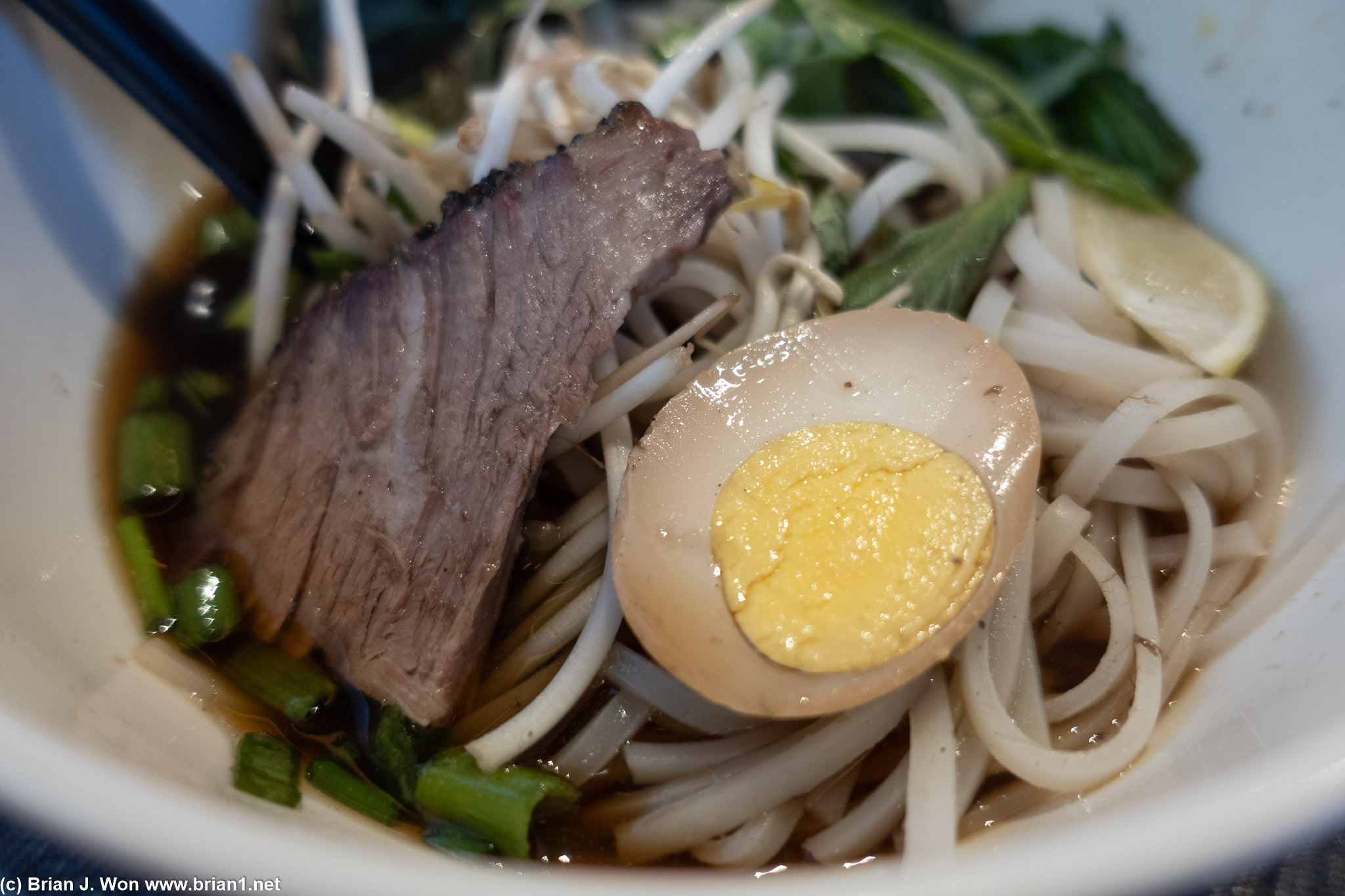 Served lukewarm and with paper-like noodles.