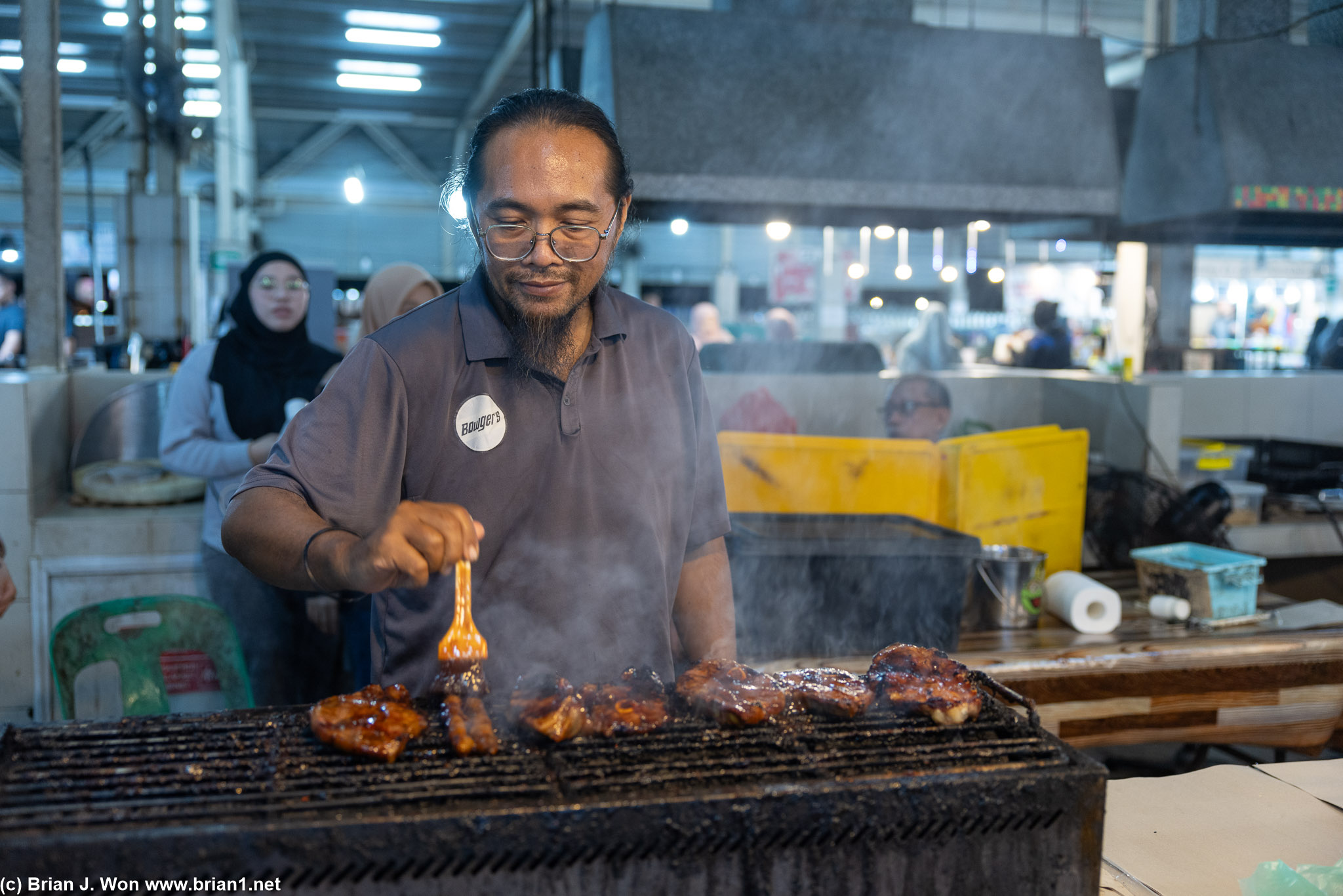 Aming's BBQ stall grilling up chicken hearts and lamb shoulder.