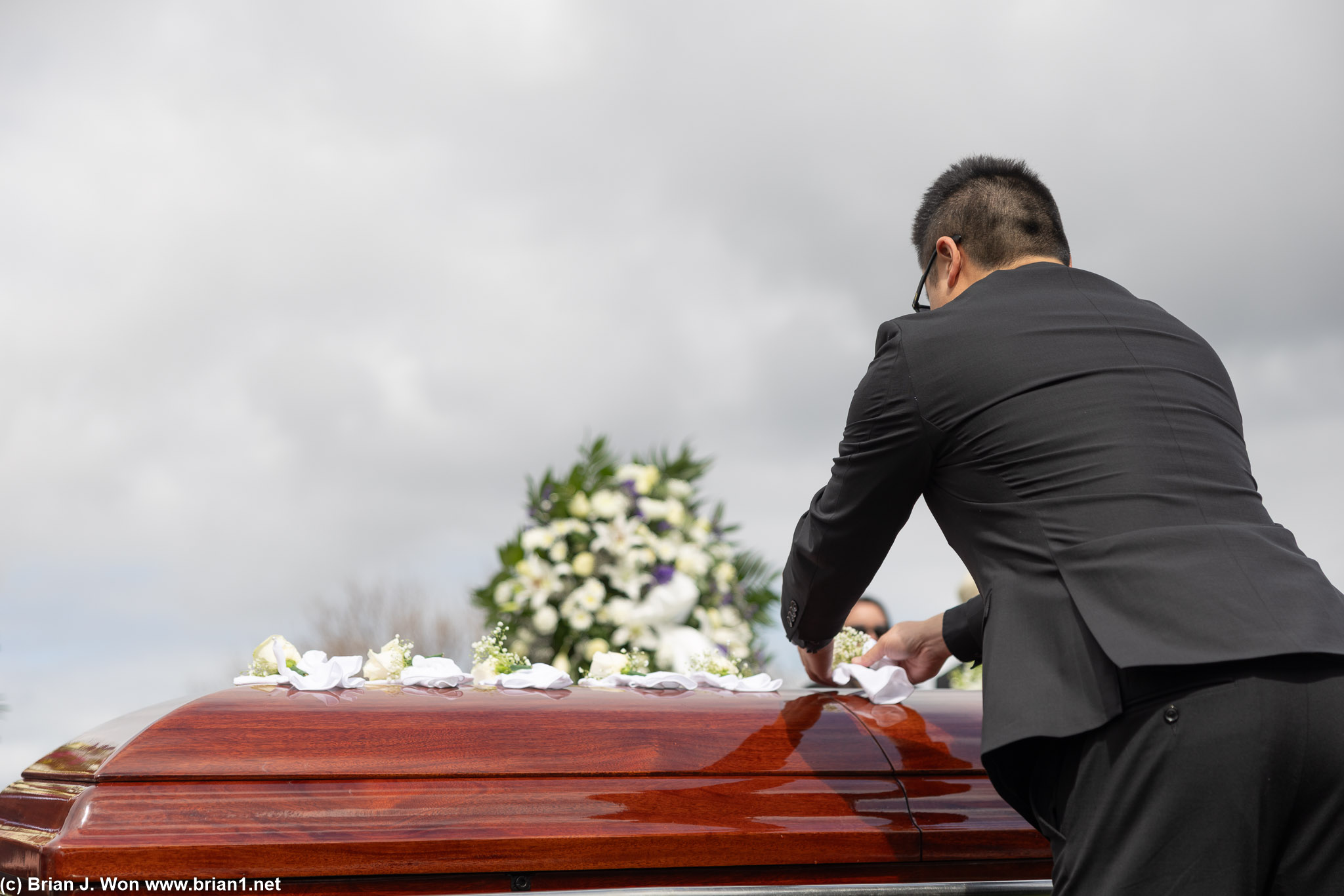 Pallbearers pay respects.