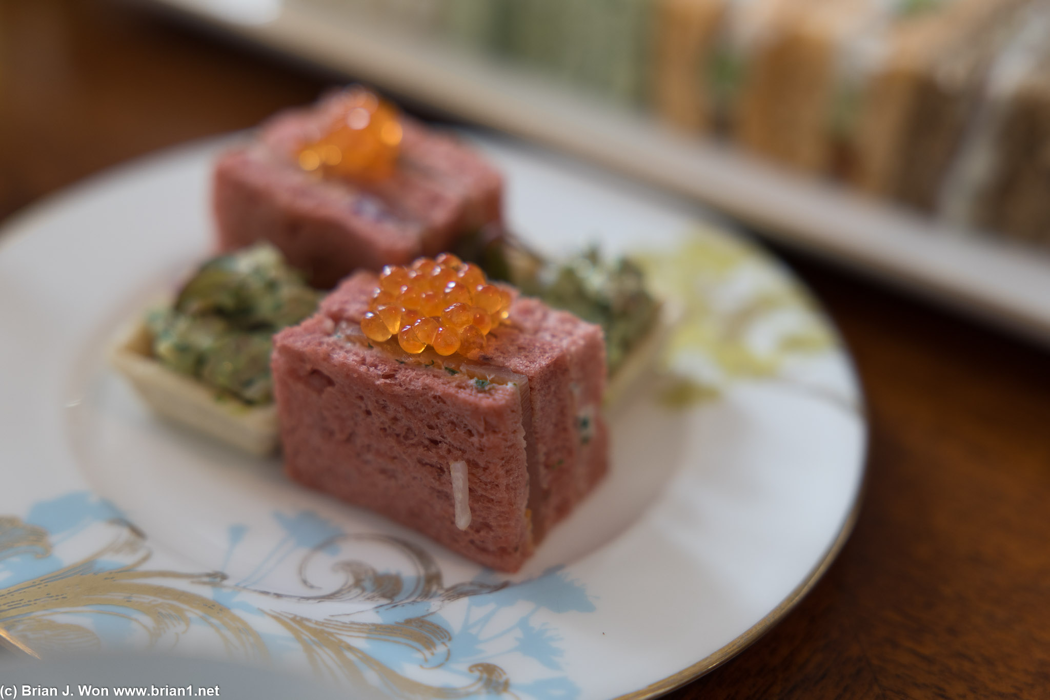 Scottish smoked salmon on beetroot bread, corn-fed chicken tartlet.
