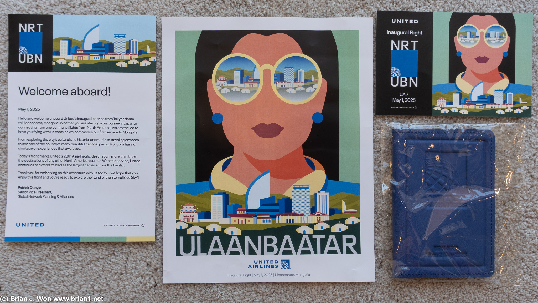 Welcome letter, welcome letter-sized poster, postcard, passport holder.