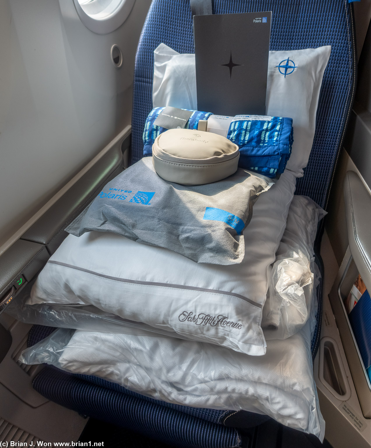 Gel pillow, menu, day blanket, amenity kit, PJ's, fluffy pillow, blanket, mattress pad.