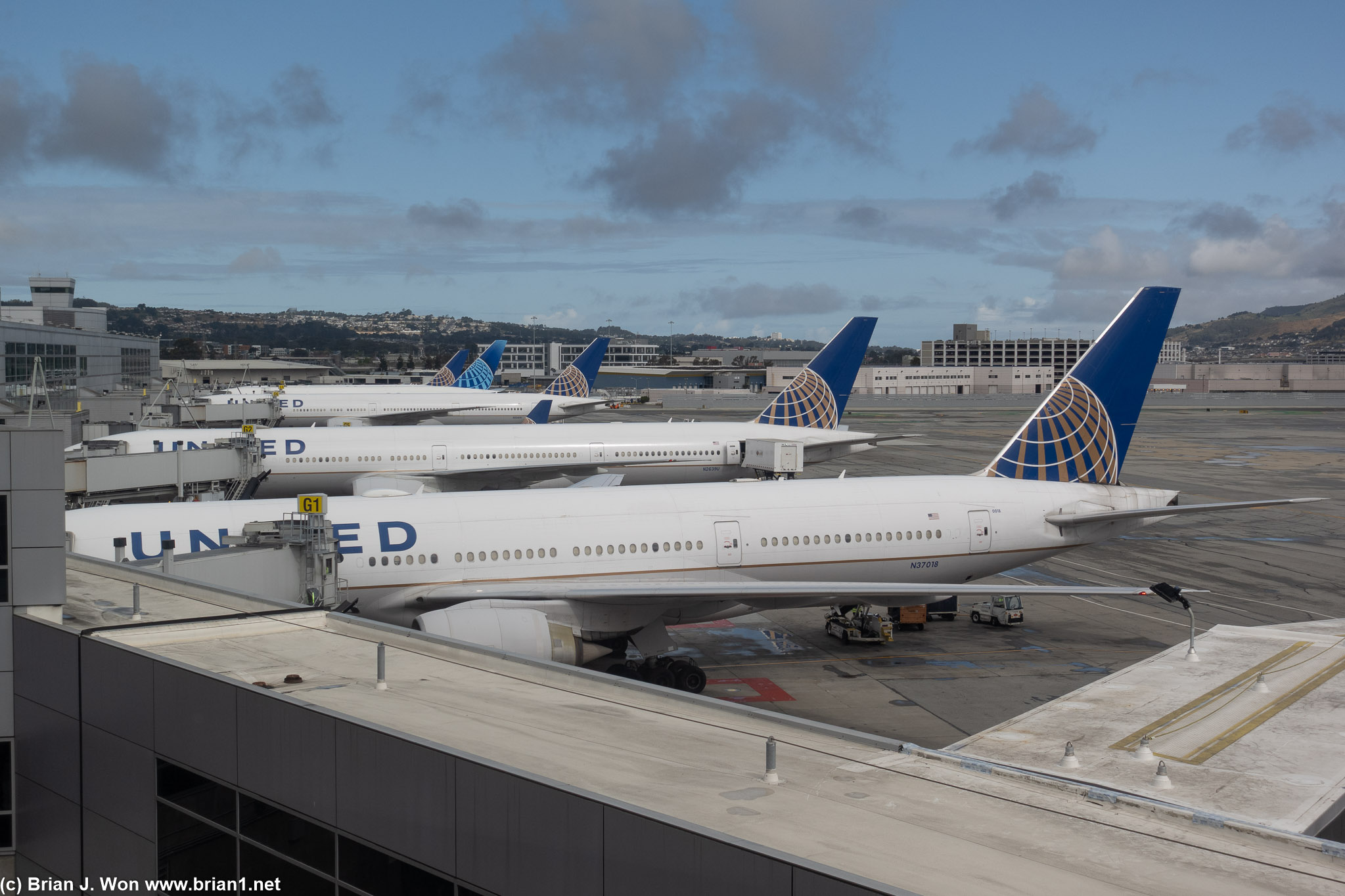 Old Boeing 777-200ER in front of a much newer 777-300ER.
