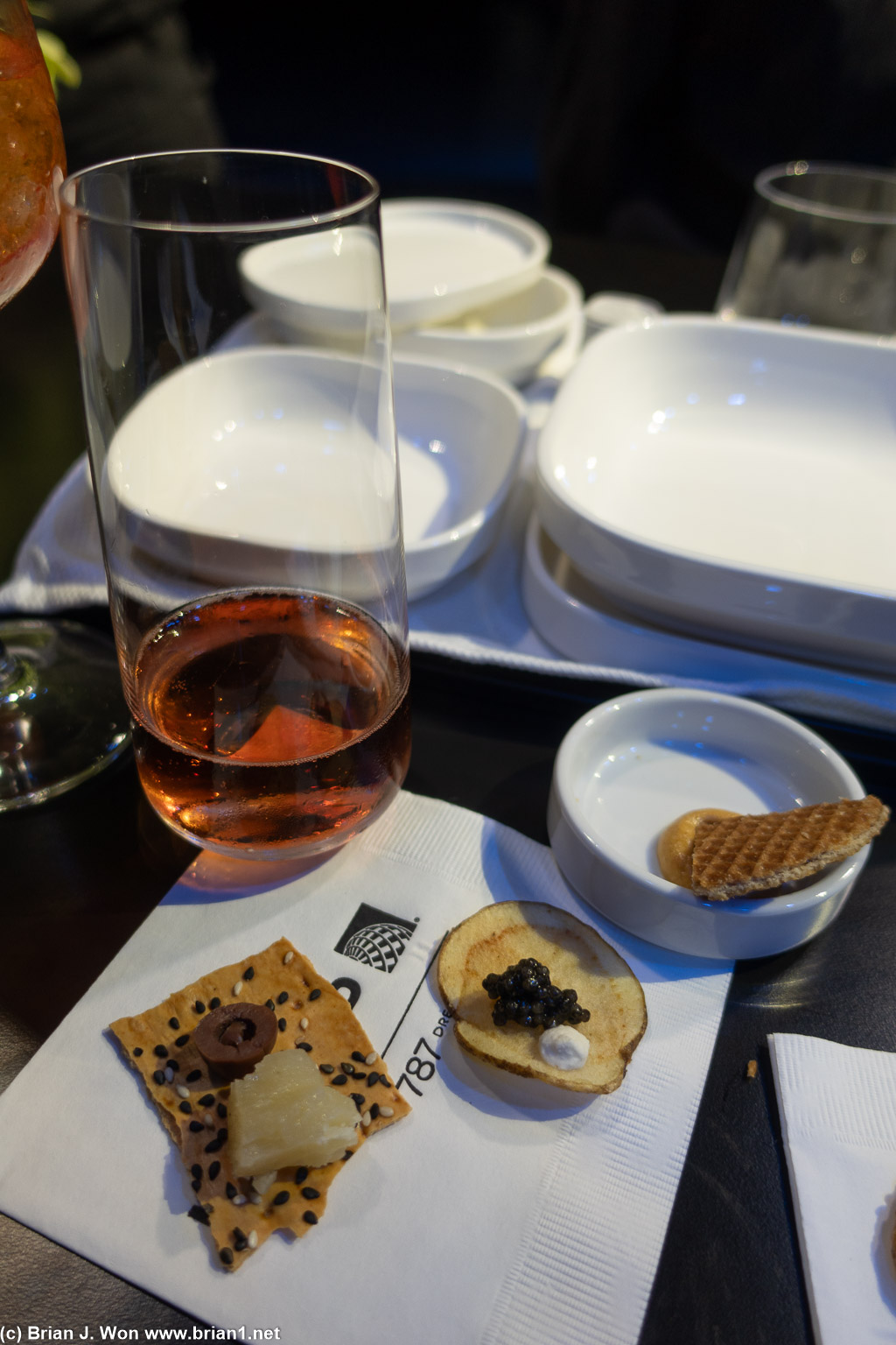 Osetra caviar on GF chip, manchego/olive on lavash, stroopwafel, aperol spritz.