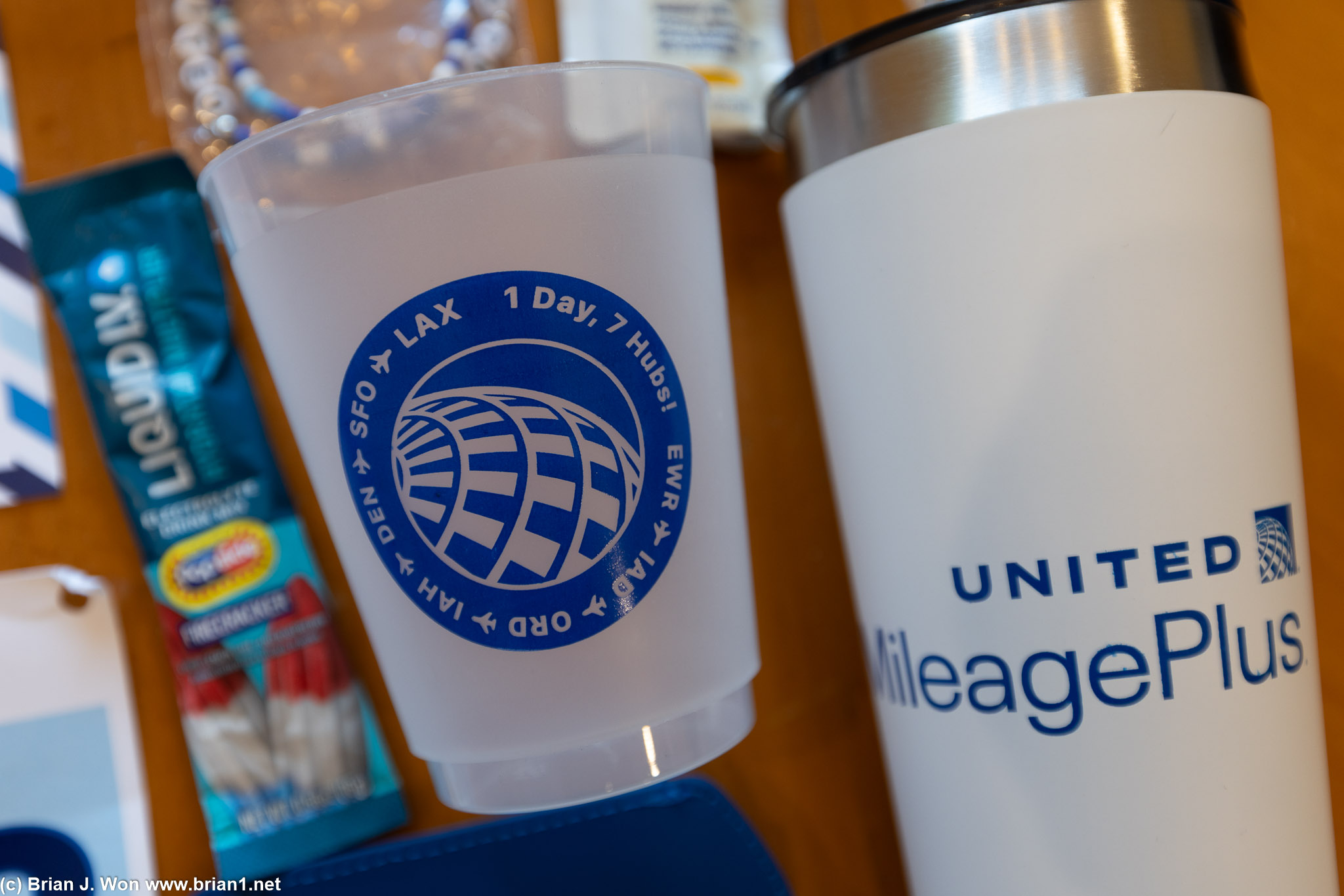 Warren's cup next to UA-provided tumbler.