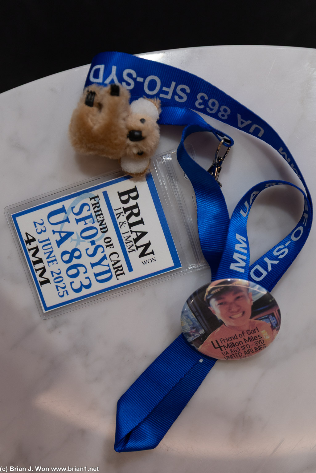 Handing out lanyards, badges, buttons, and koalas.